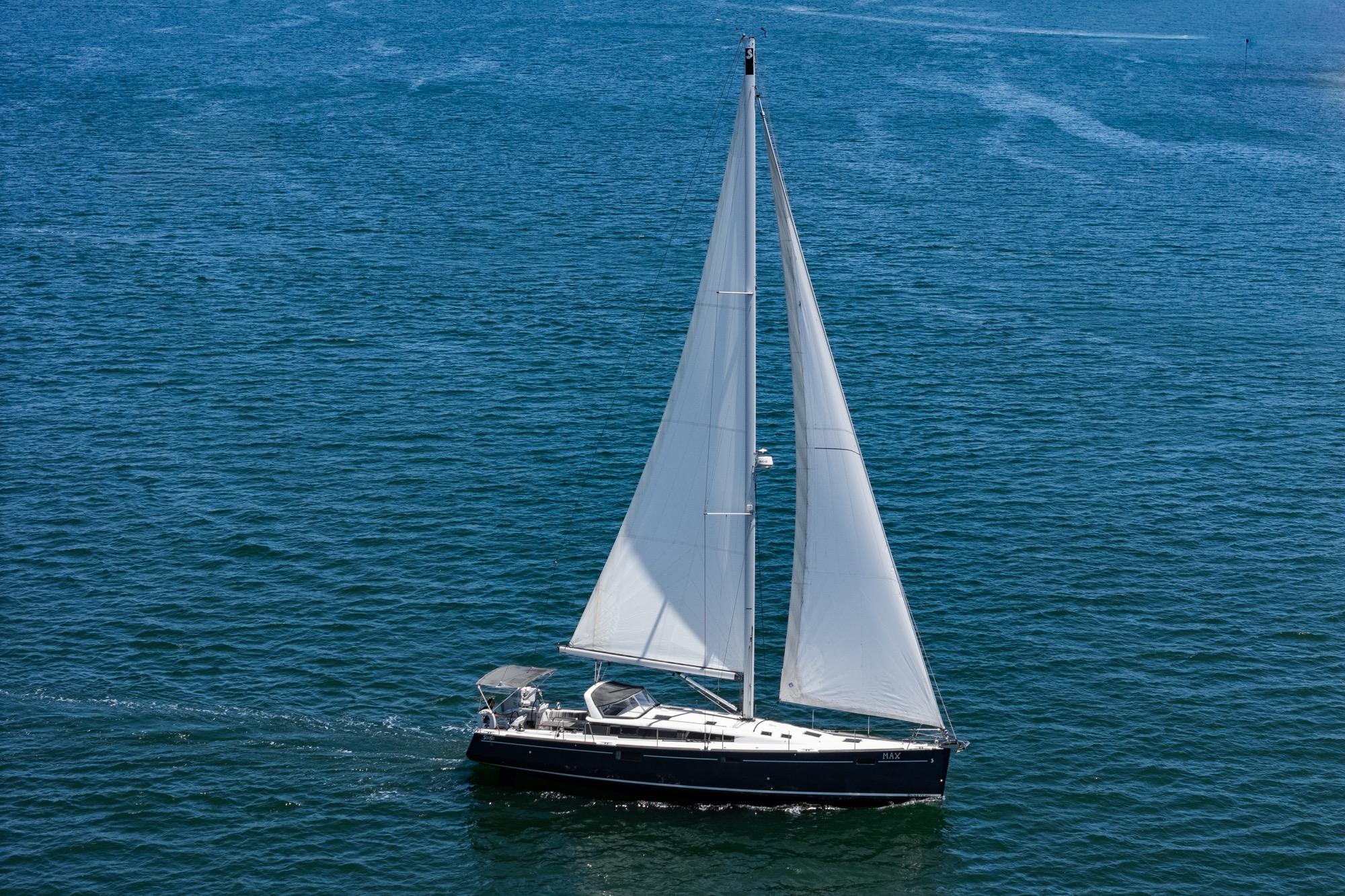 2017 Beneteau Sense 50 sailing on open water with full sails.