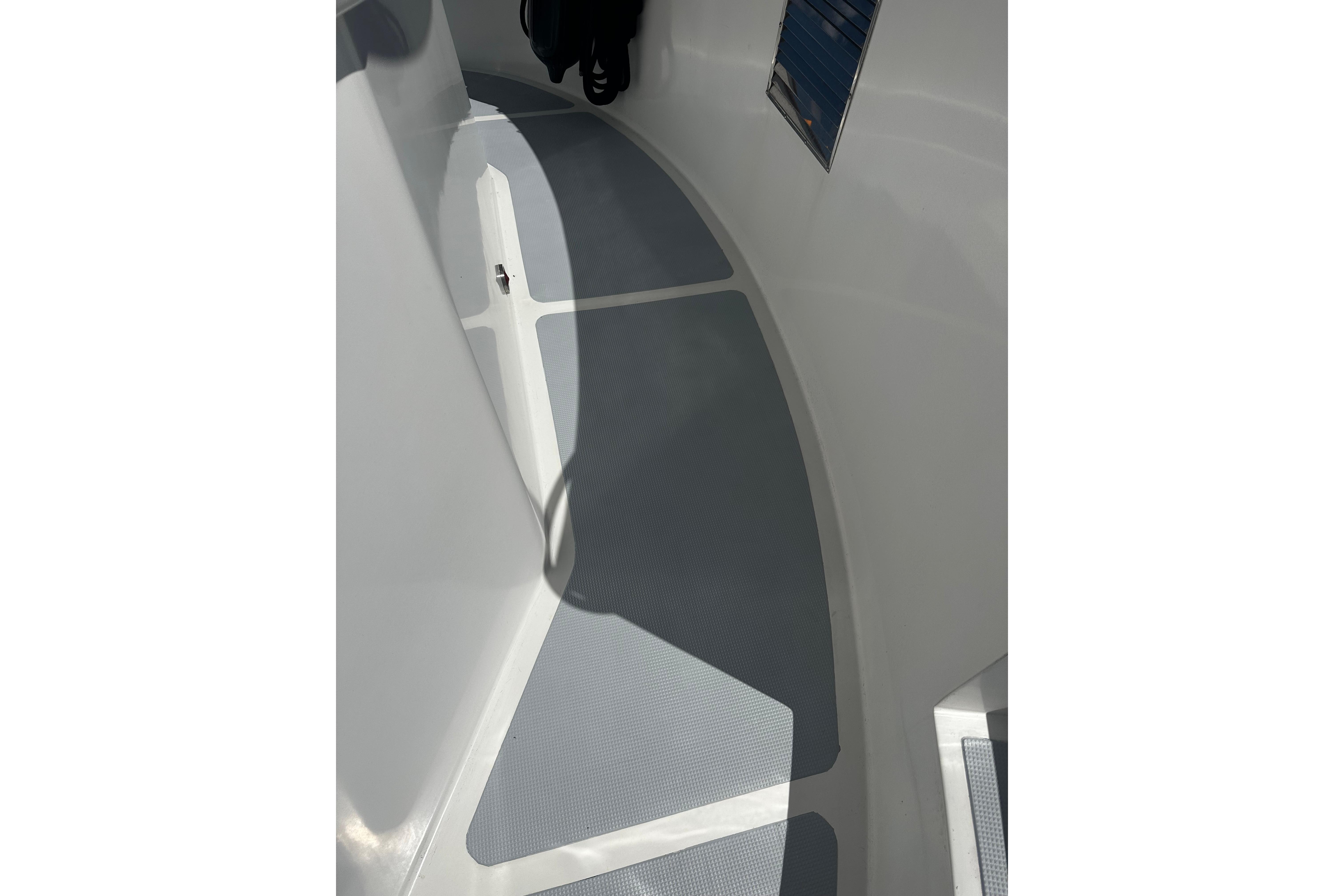 1998 Nordhavn 46 boat deck with non-slip surface and clean white finish.