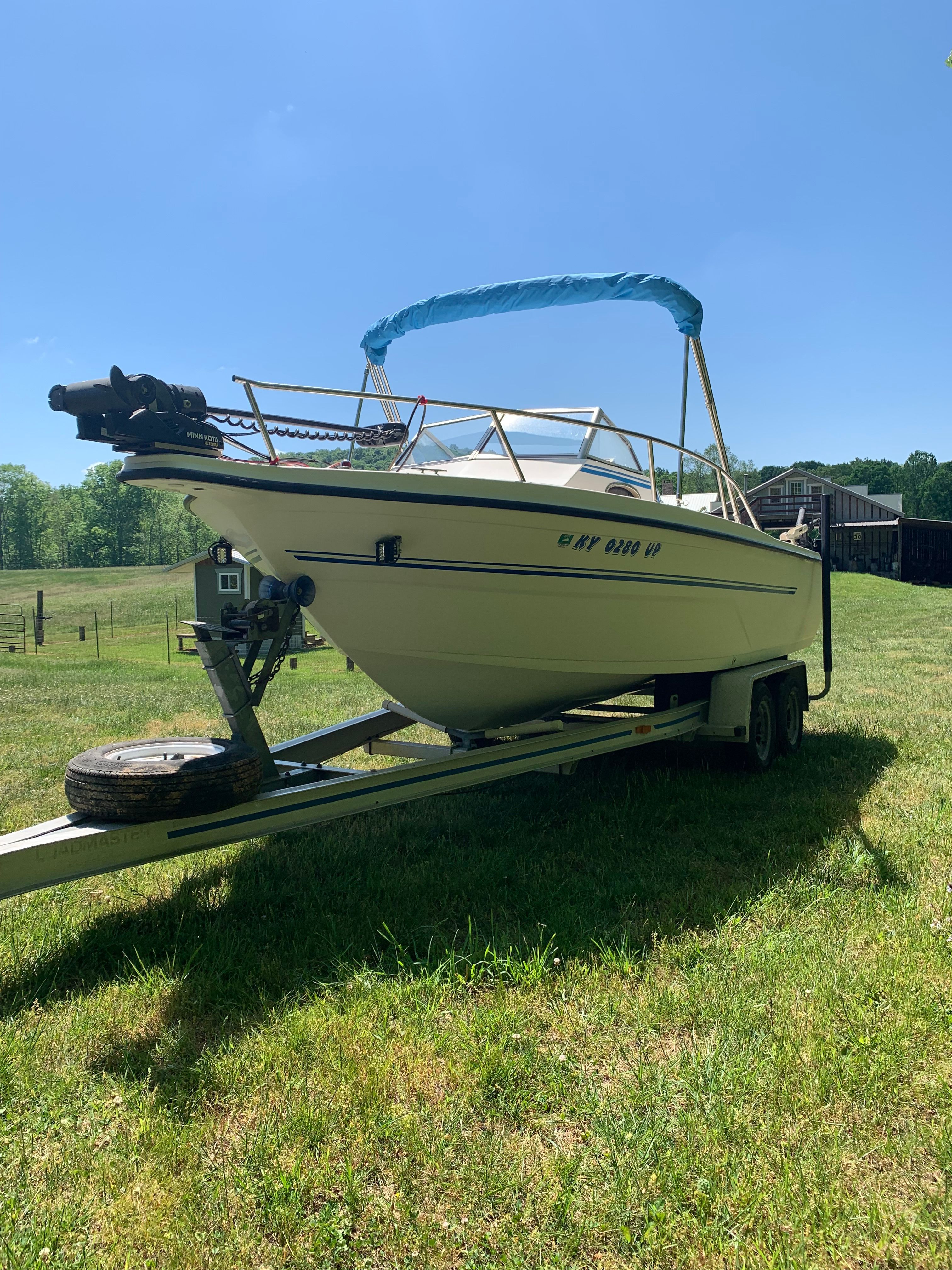 1998 Eurosport 221WA boat on trailer outdoors.