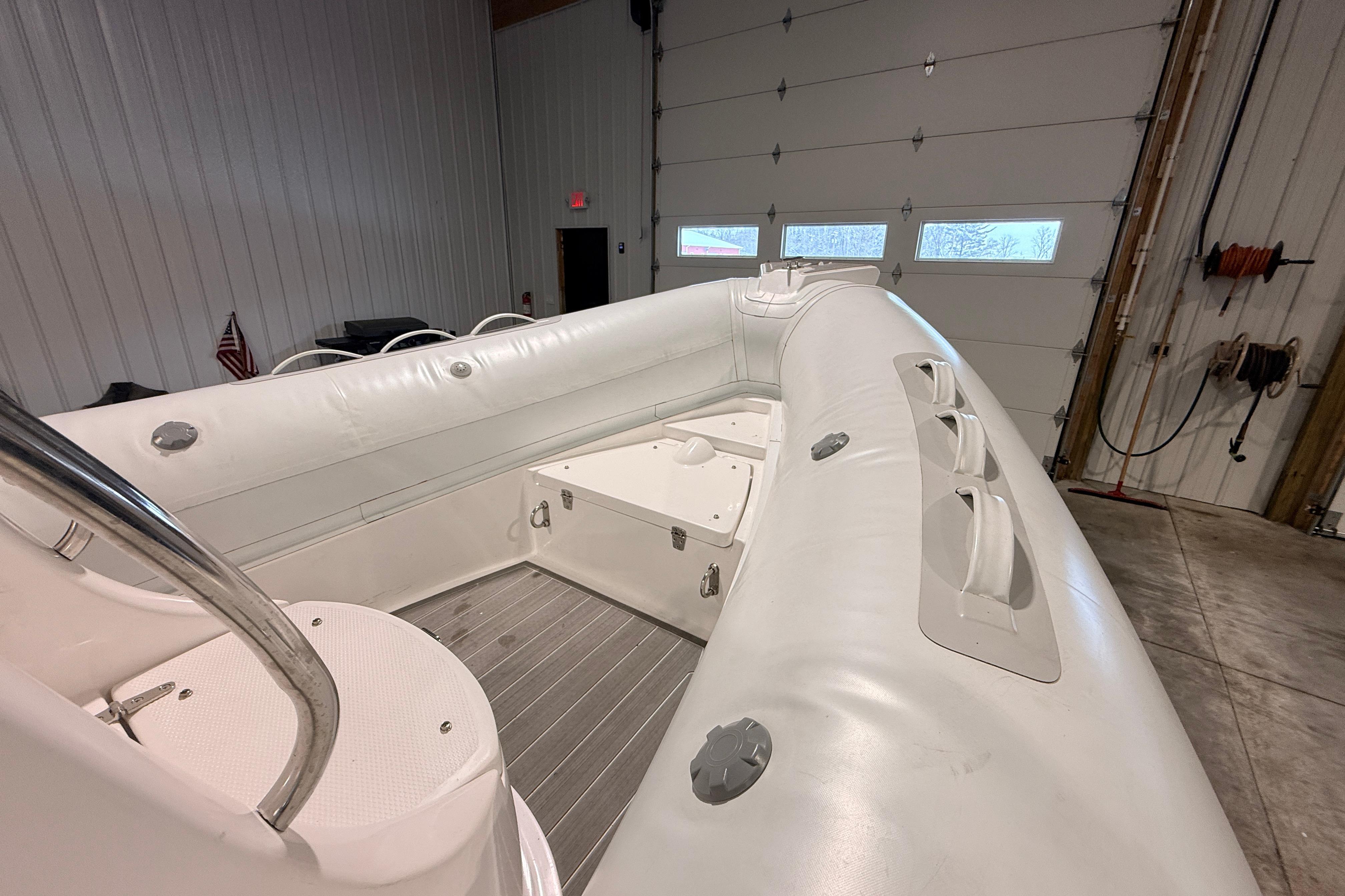2024 Paradise Powerboats 580 inflatable boat interior in a garage setting.