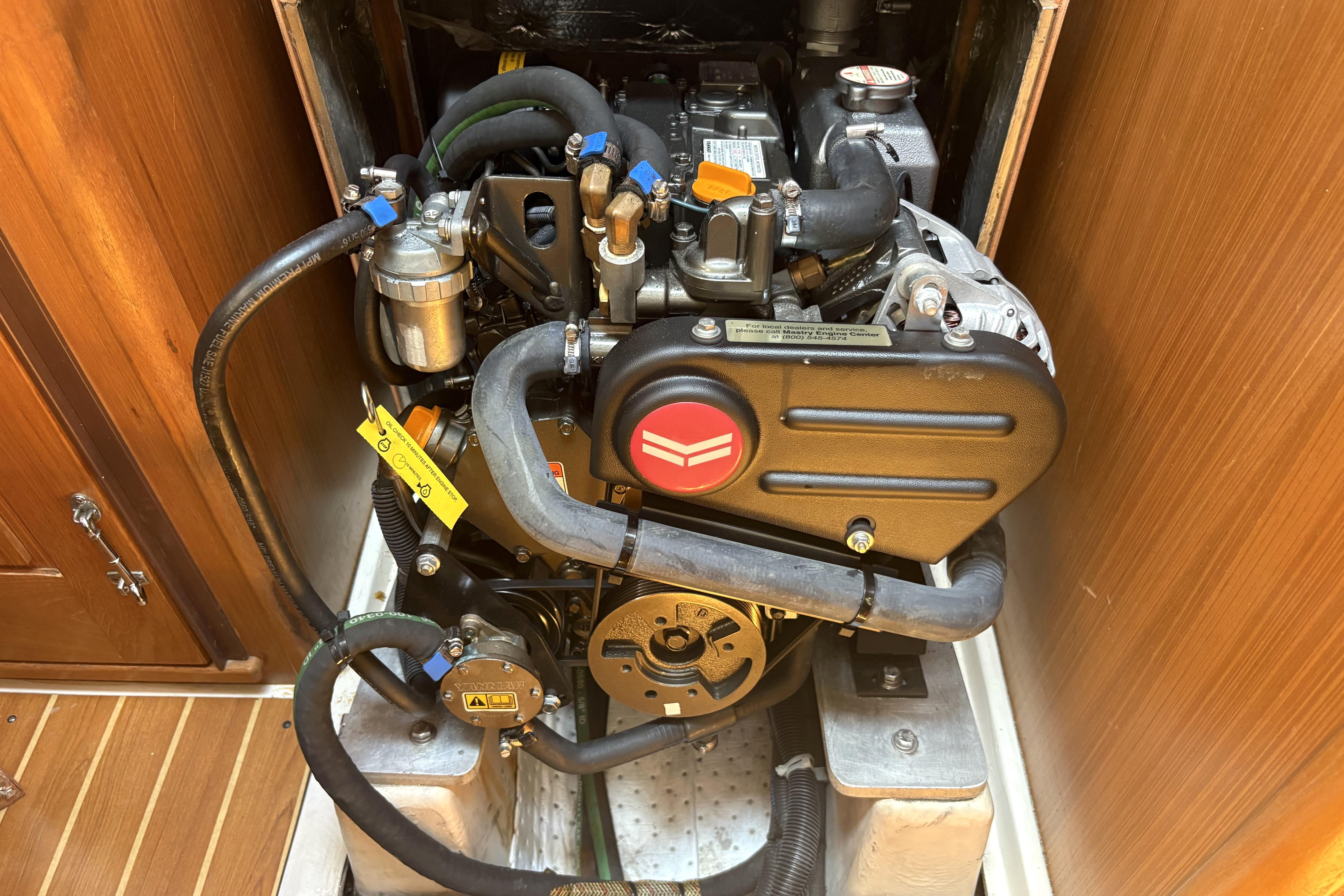 Engine compartment of a 2011 Catalina 355 sailboat, showcasing detailed mechanical components.