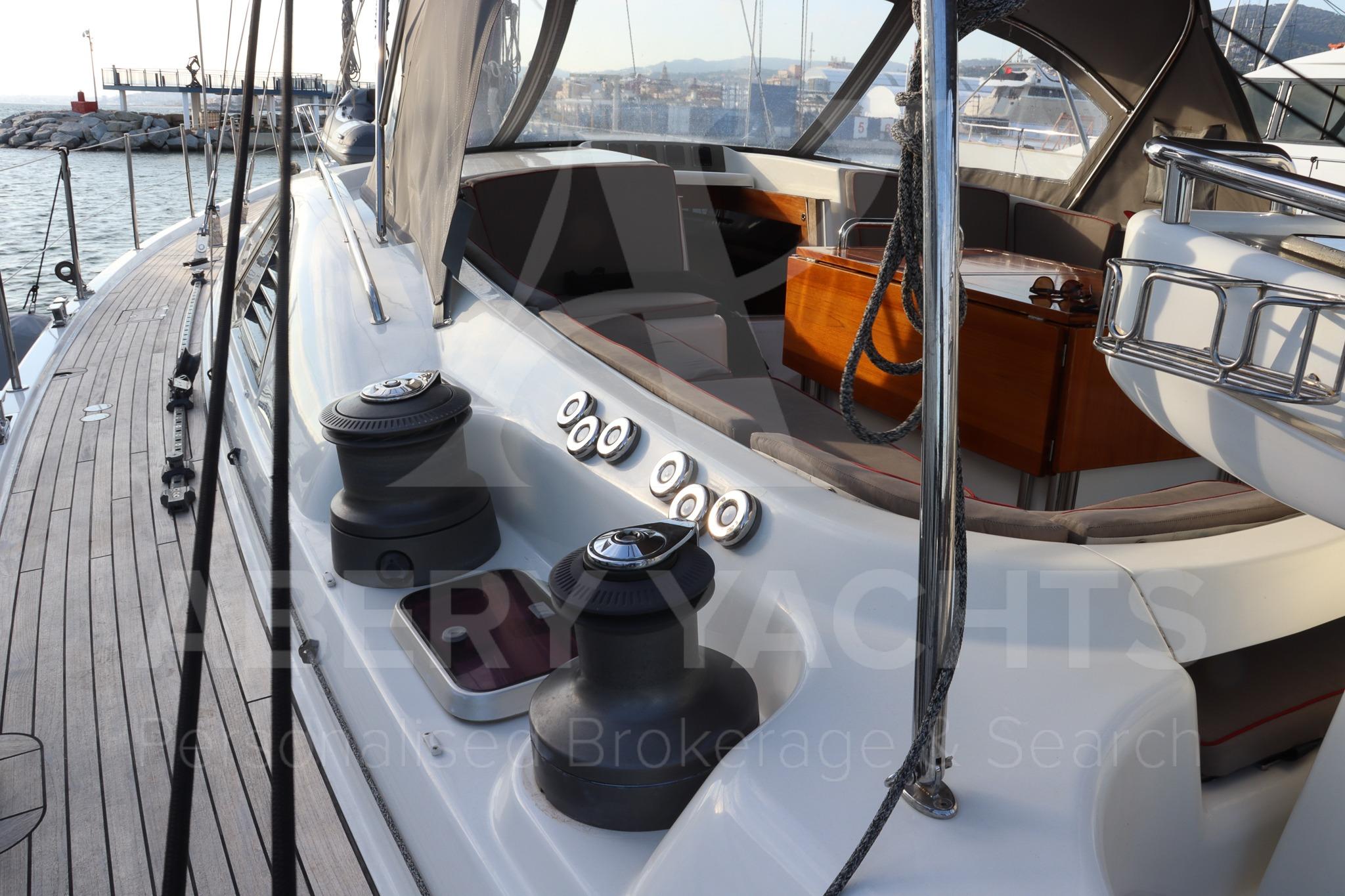 Deck view of 2008 Oyster 72 yacht with winches and seating area.