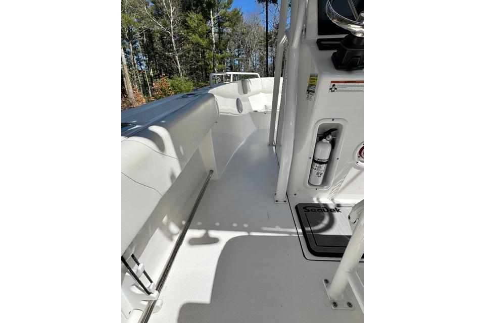 2021 Edgewater 208CC boat interior with white deck and safety equipment.