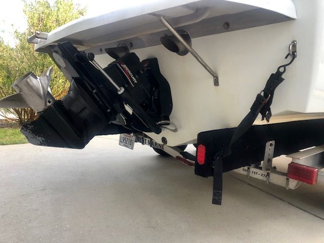 The image shows the stern of a 2003 Baja 20 Outlaw boat on a trailer.