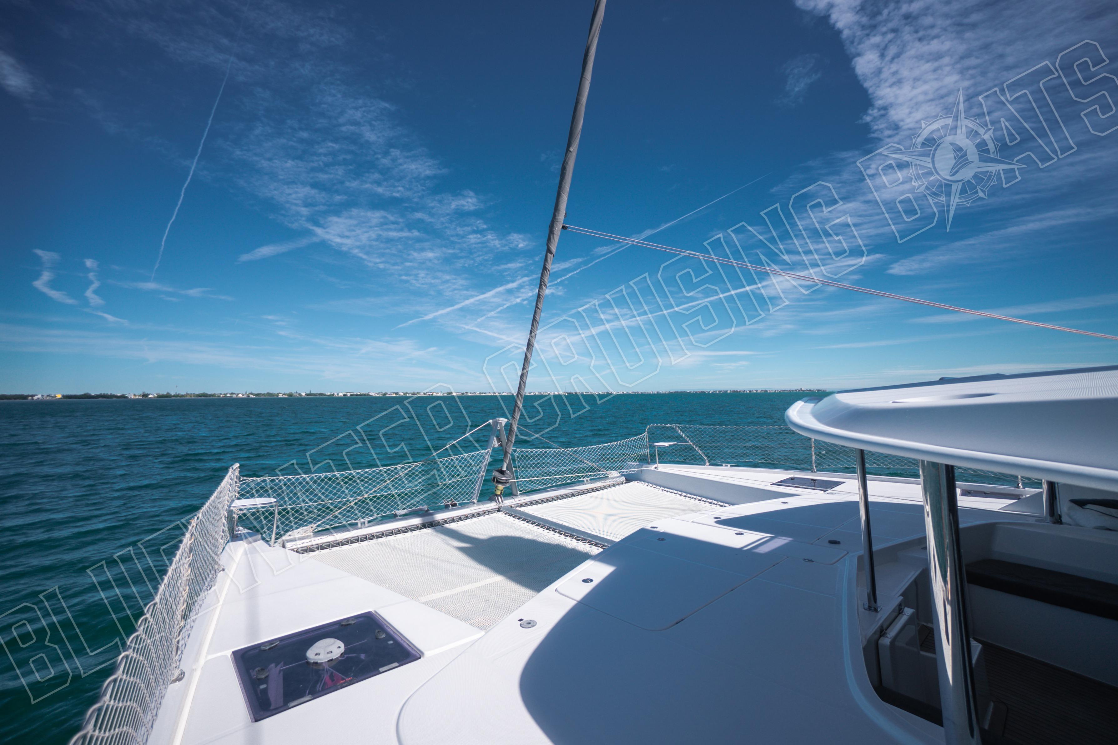 Leopard 58 yacht deck with ocean view under clear blue sky, 2020 model.
