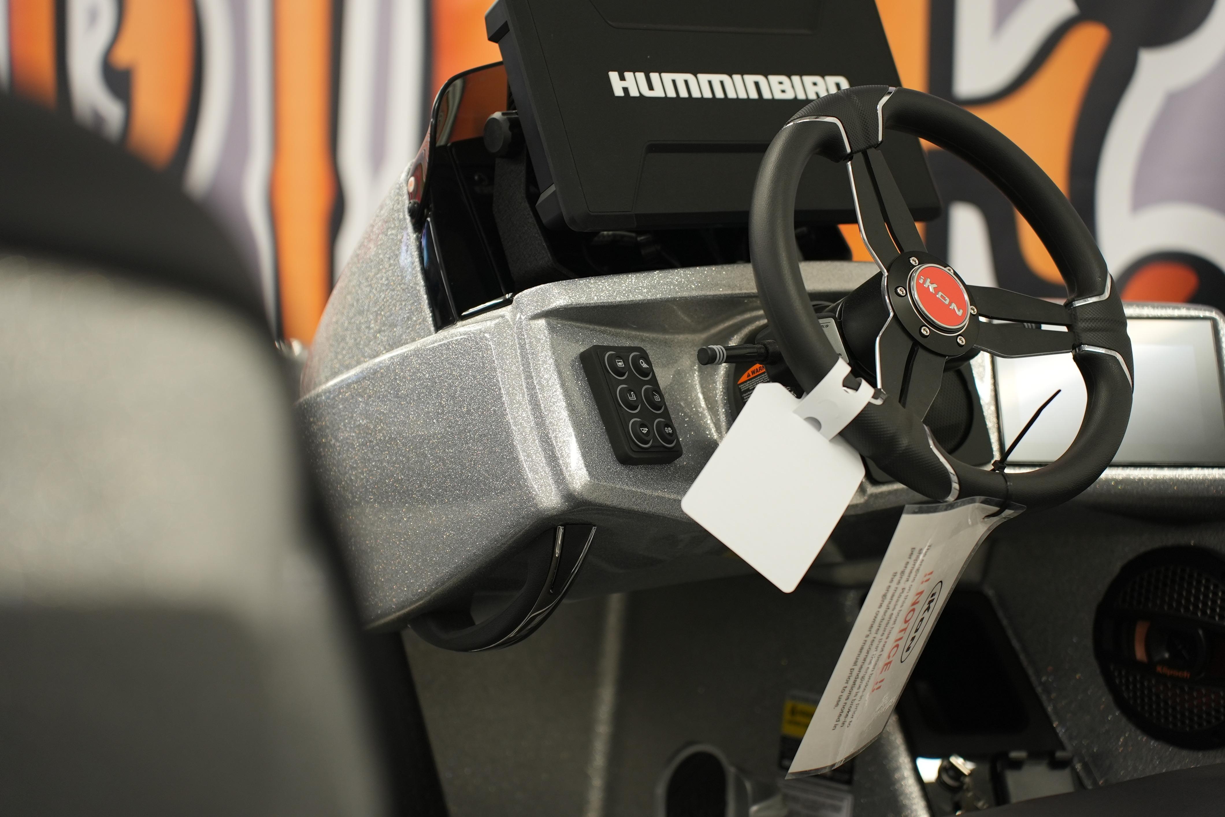 Steering wheel and dashboard of 2026 iKon LXE20 boat with Humminbird display.