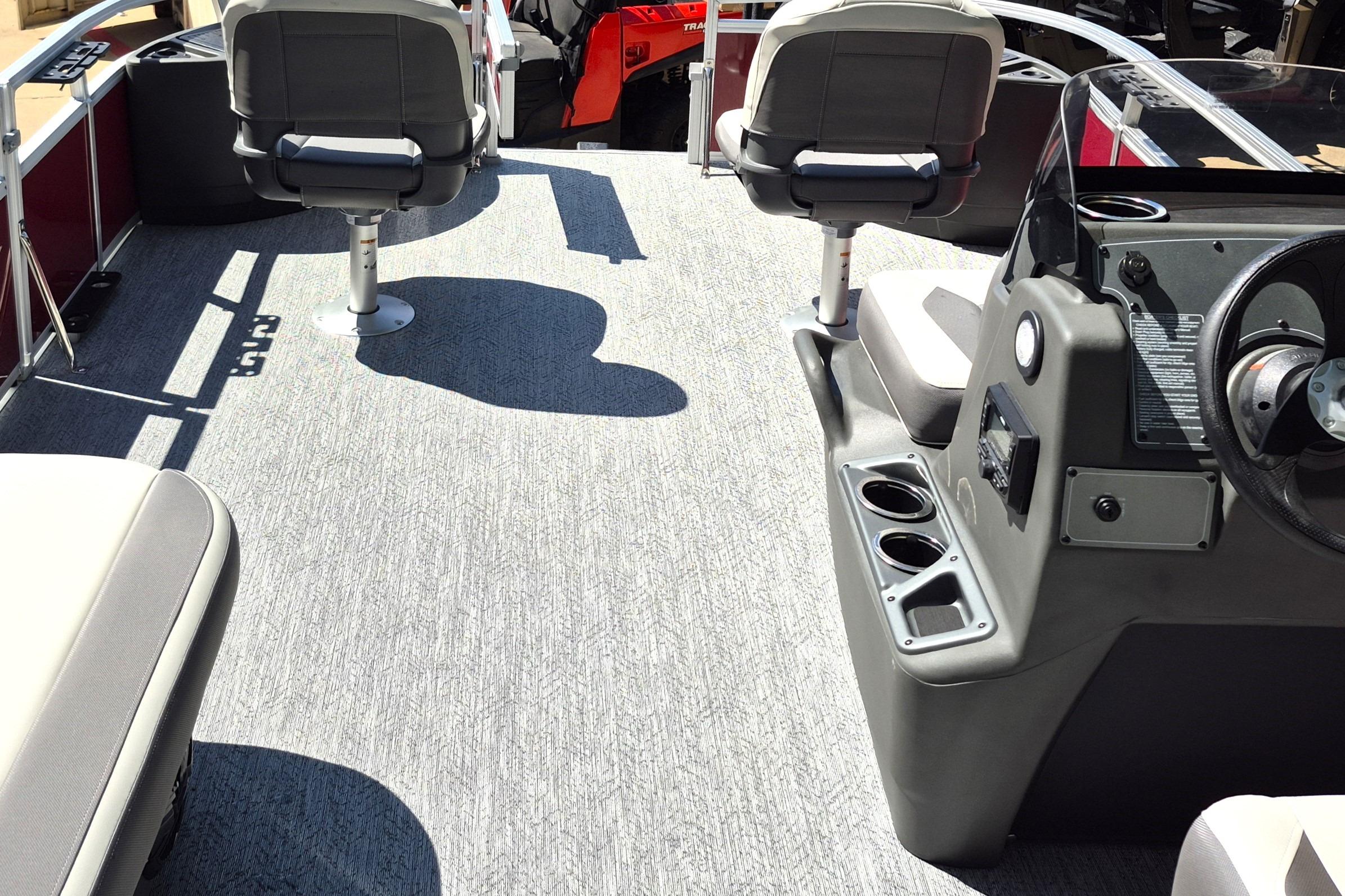 2026 Sun Tracker Bass Buggy 18 DLX interior with seating and steering console.