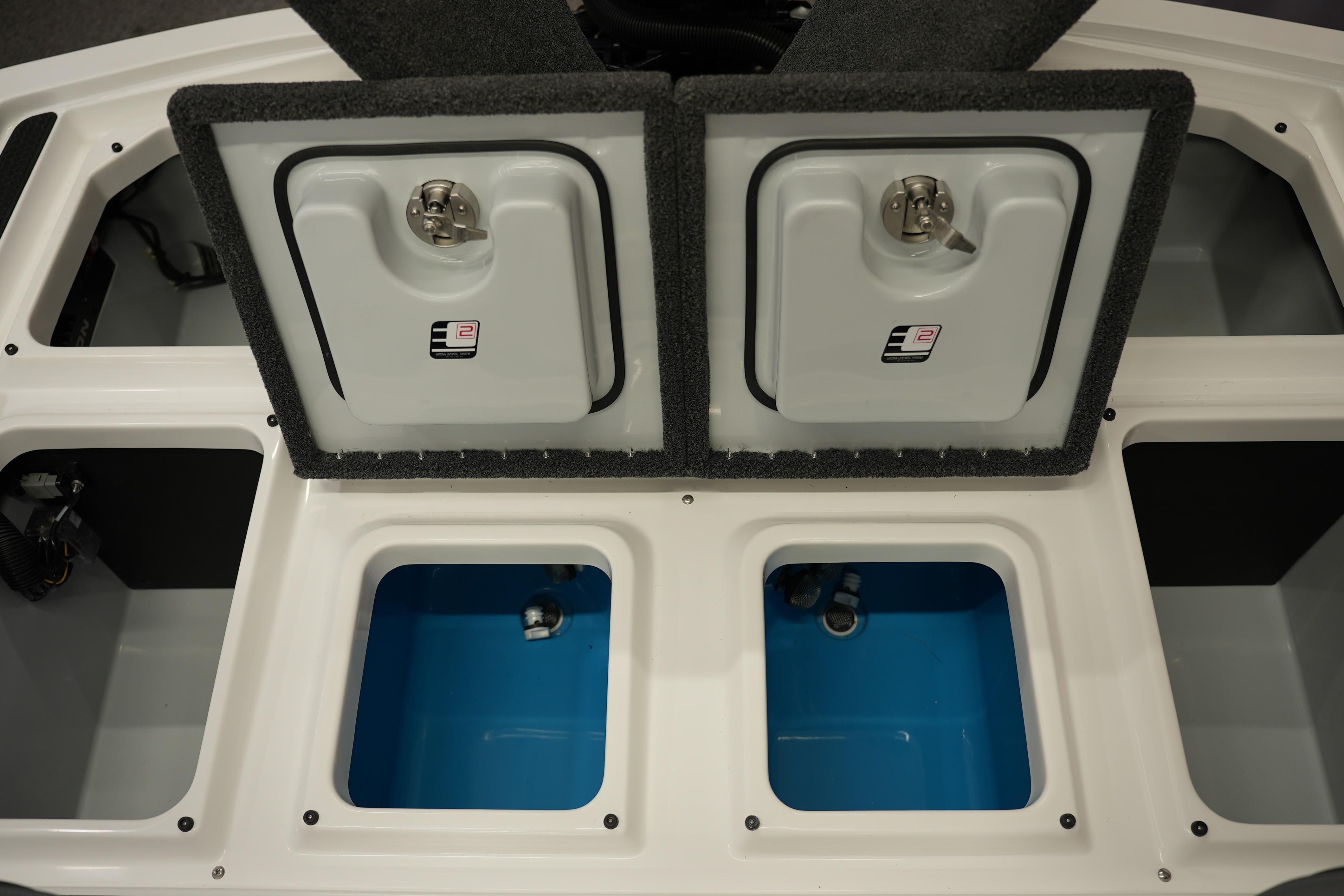 2026 iKon VLE21 boat storage compartments with open lids and blue interior.