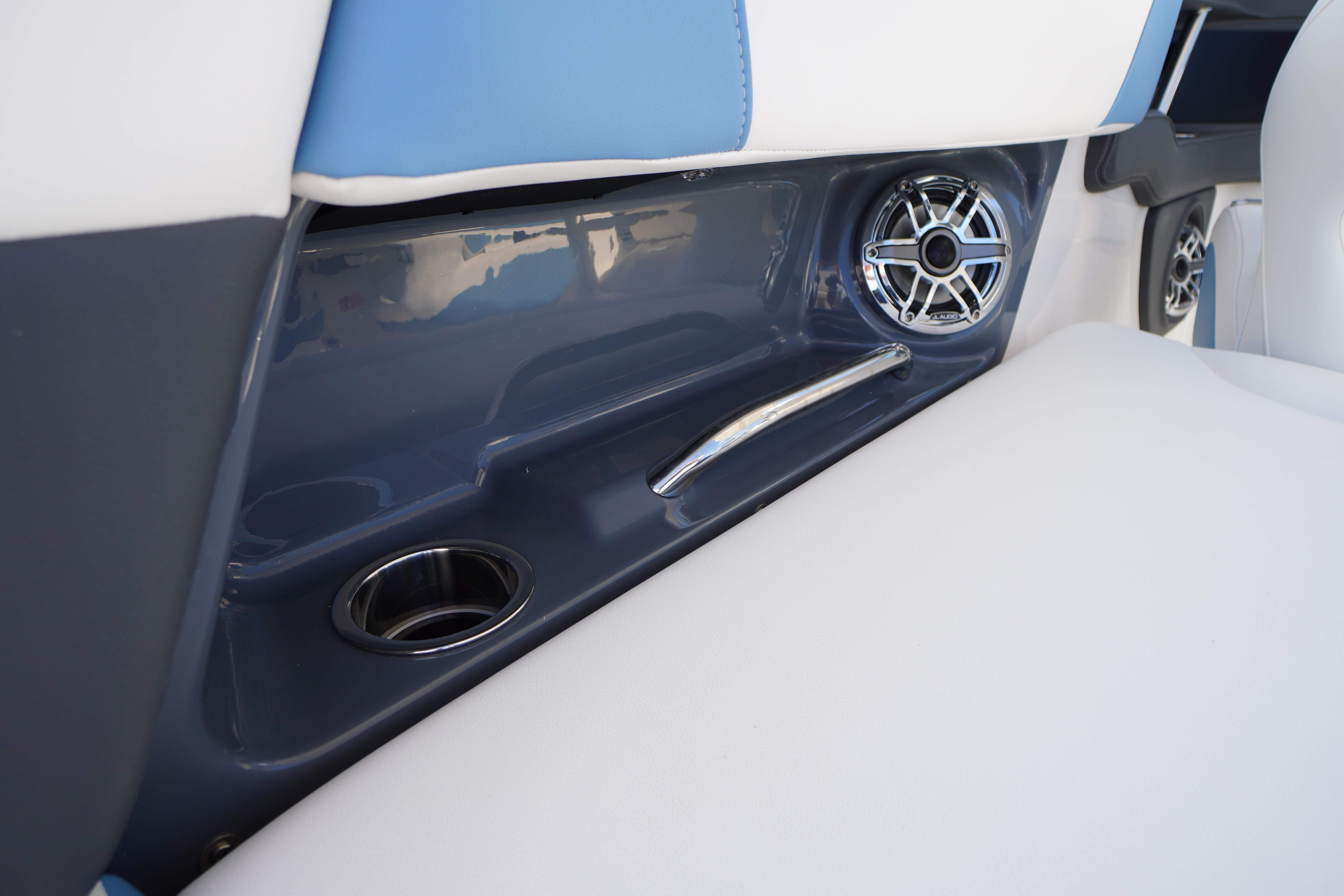 2026 Chaparral 270 OSX boat interior with cup holder and speaker detail.