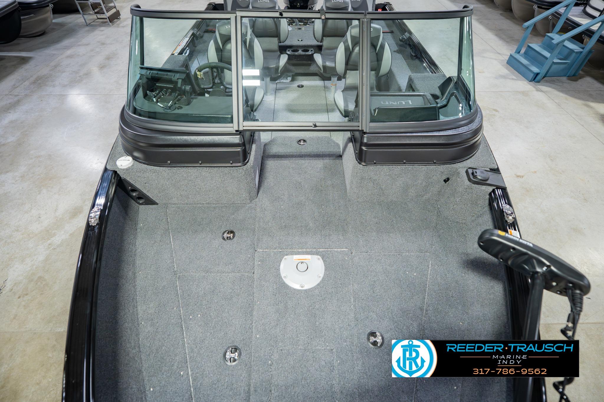 2026 Lund 1775 Impact XS boat interior with seating and steering wheel, showcased at Reeder Trausch Marine.