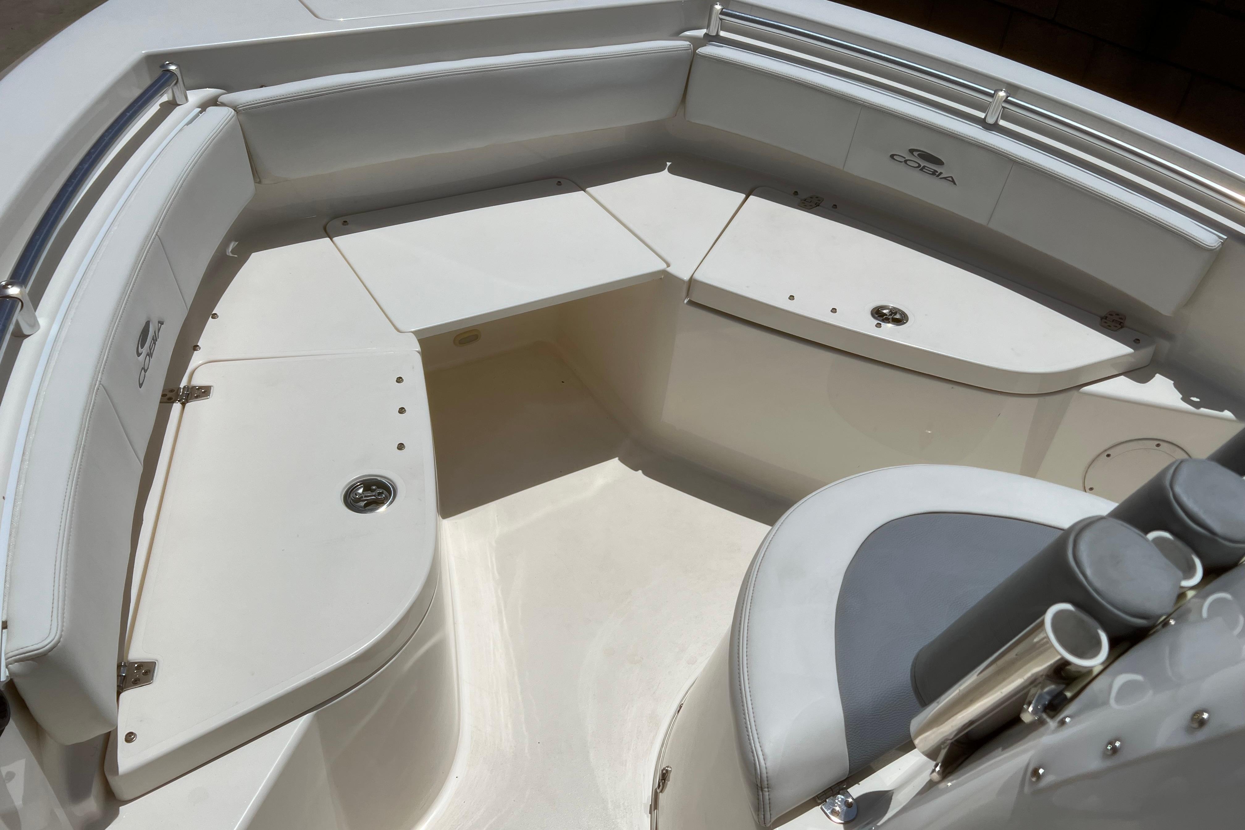 2018 Cobia 201 Center Console boat interior with seating and storage compartments.