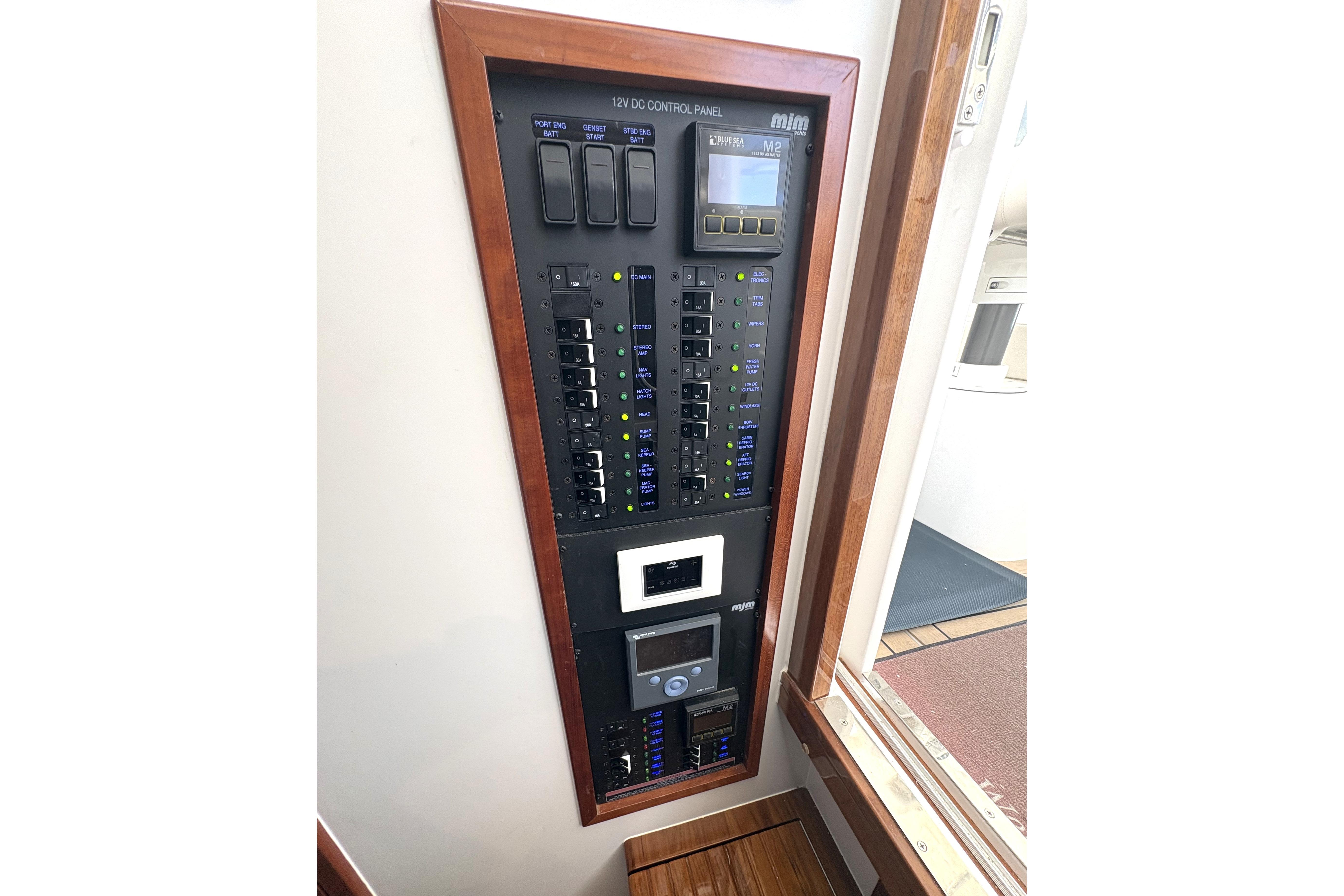 2024 MJM 35z yacht control panel with switches and digital display.