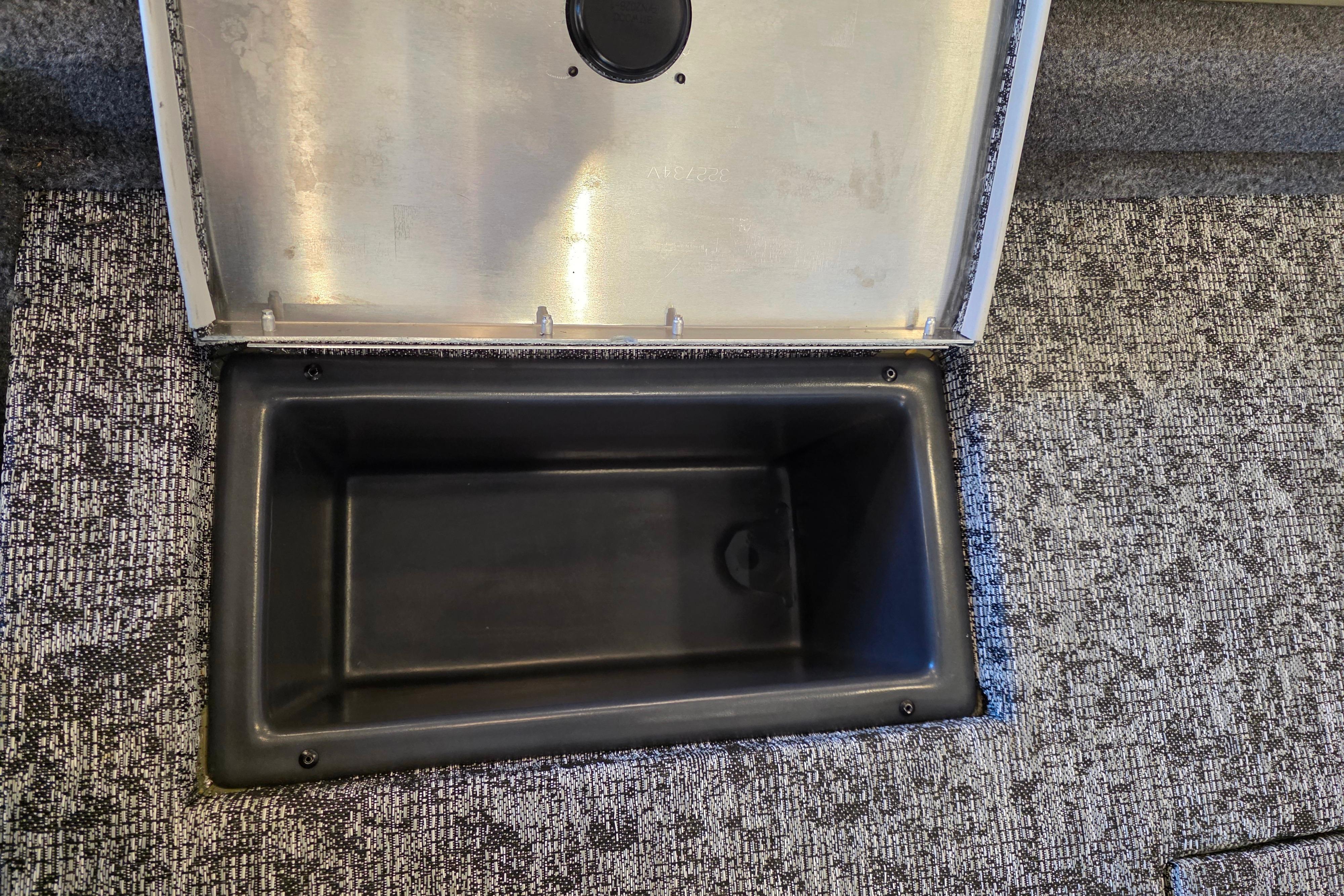 Open storage compartment in 2026 Tracker Pro Team 175 Crappie Edition boat.