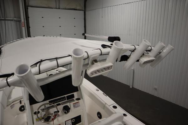 2025 Sea Fox 228 Commander boat interior with rod holders and control panel.