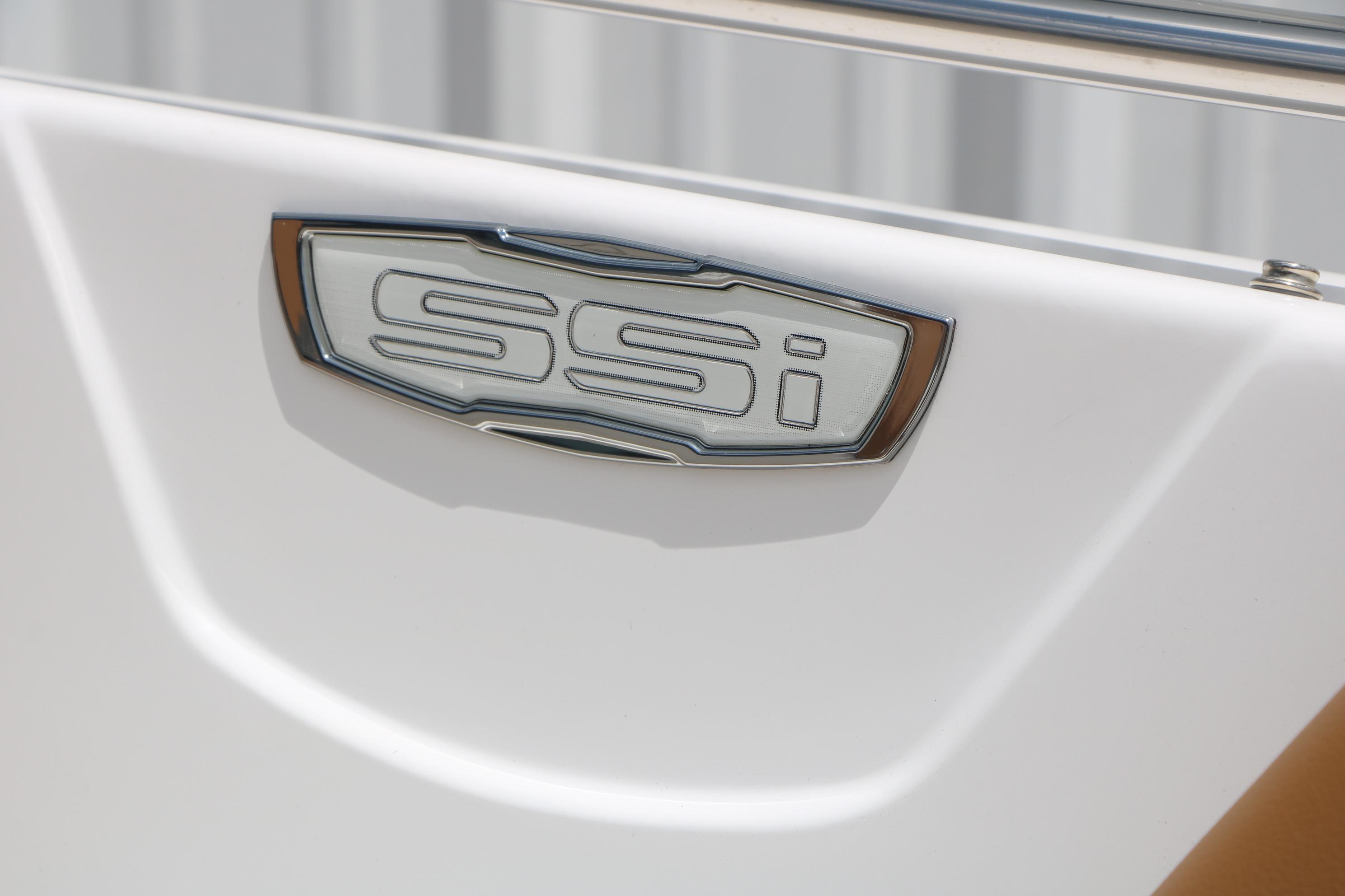 2025 Chaparral 23 SSi boat emblem on white surface.