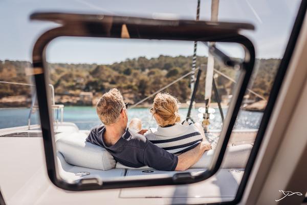 Couple relaxing on Nautitech 44 Open yacht, enjoying scenic ocean view, 2025 model.