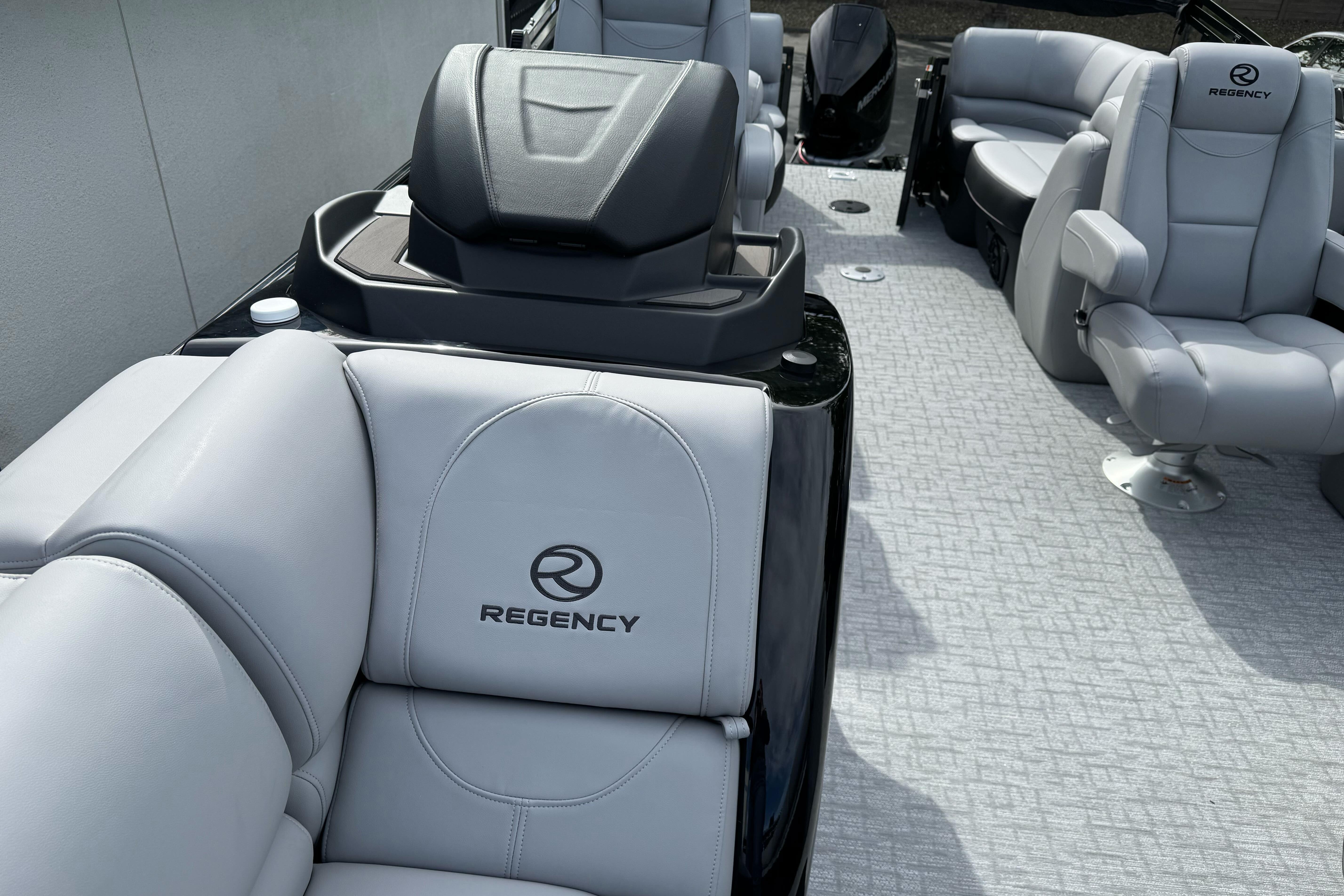 2026 Regency 250 DL boat interior with luxurious gray seating and modern design.