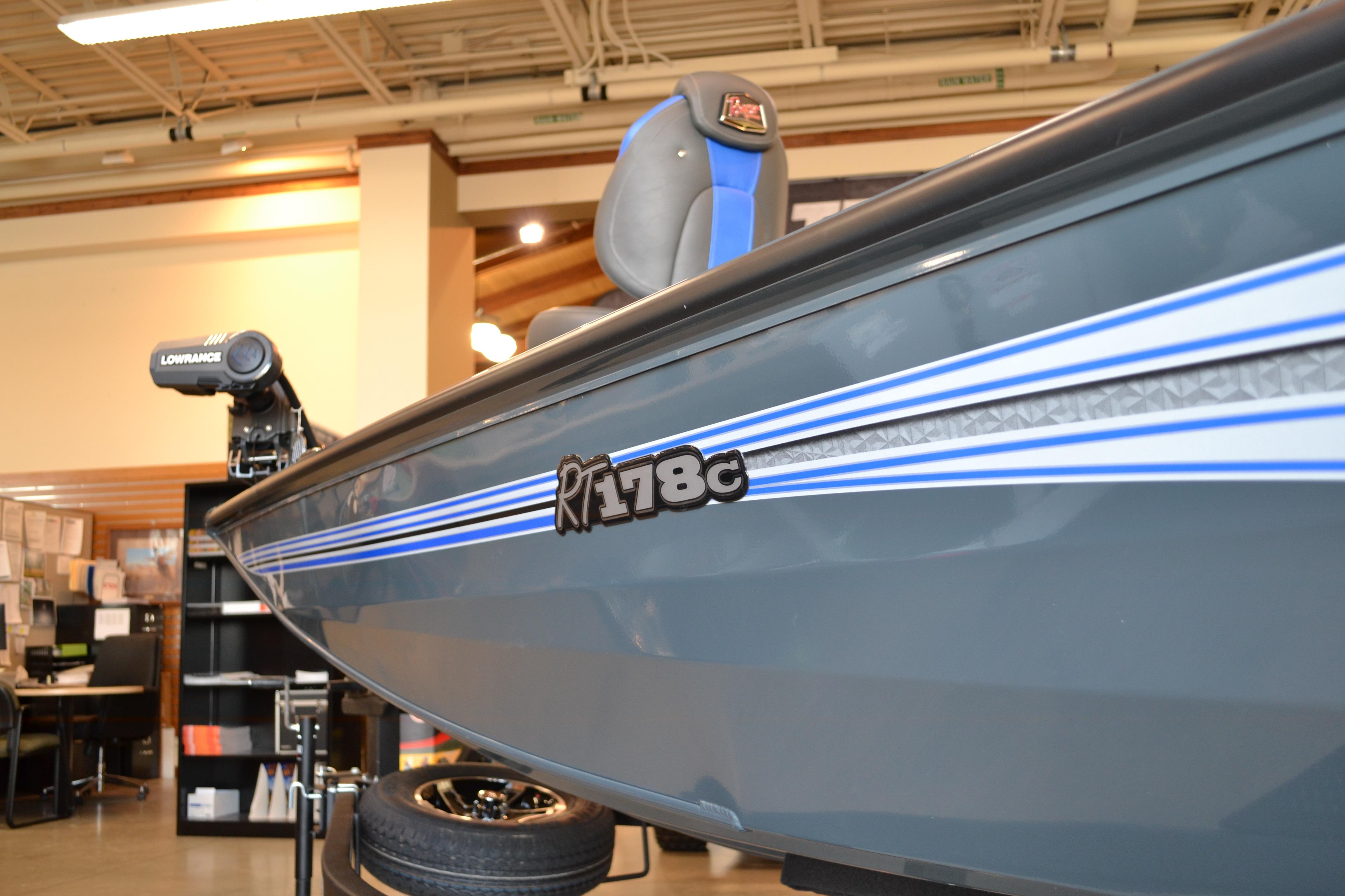 2026 Ranger RT178C boat with blue stripes displayed indoors.
