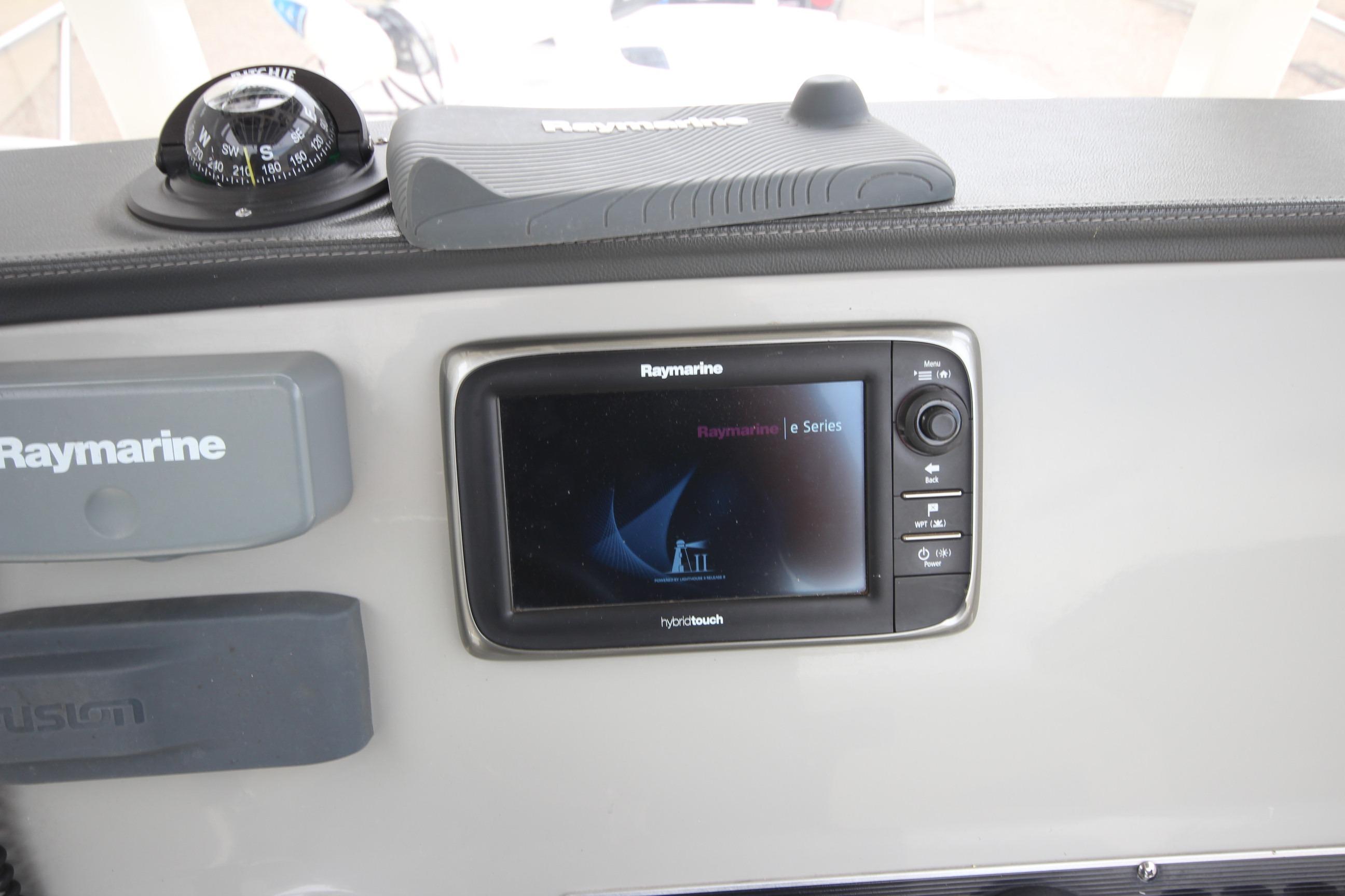 Raymarine navigation system on 2014 Boston Whaler 210 Dauntless boat dashboard.