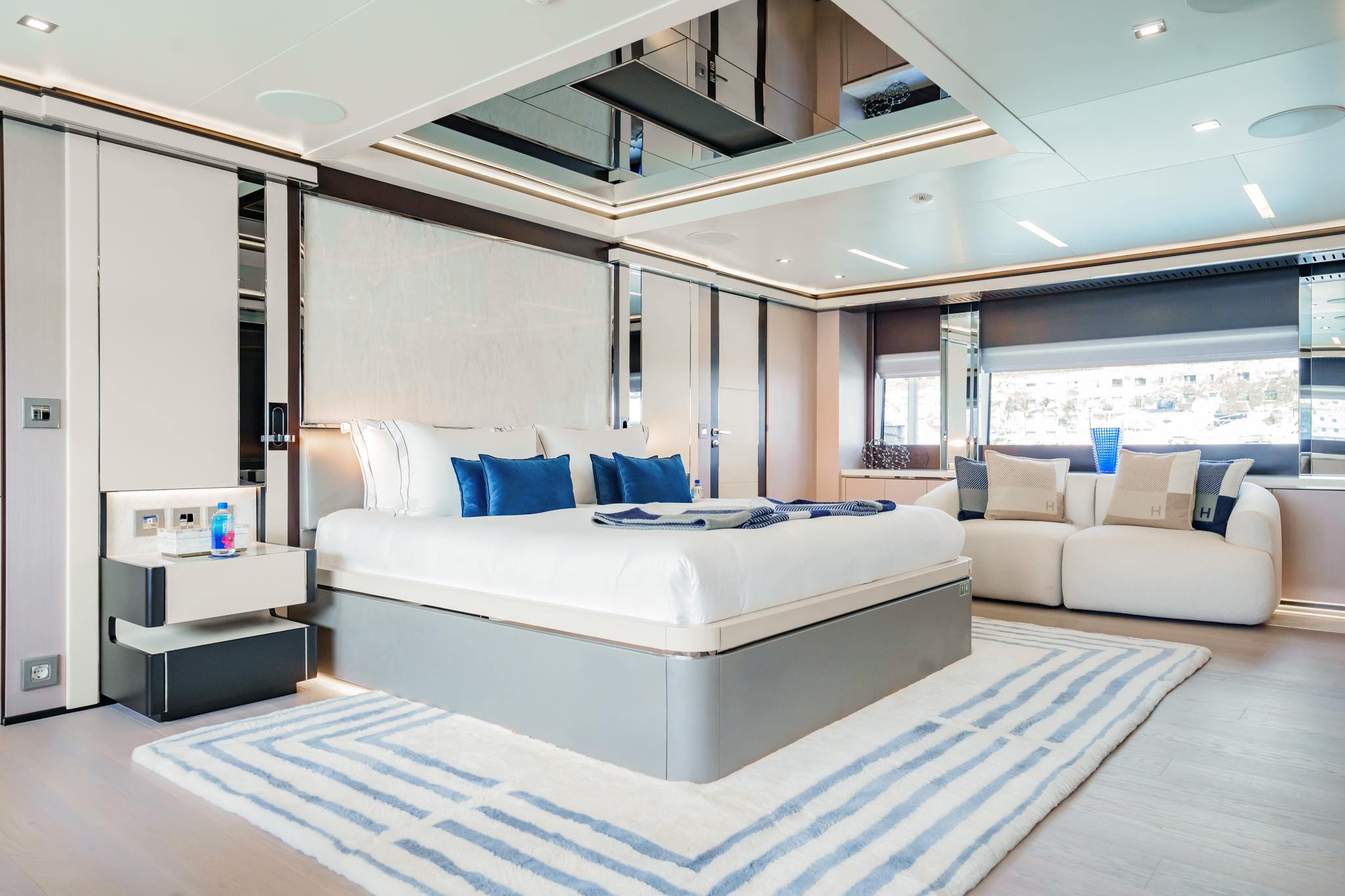 Luxurious Mondomarine 50 metre yacht bedroom, 2016 model, featuring elegant modern design and plush furnishings.
