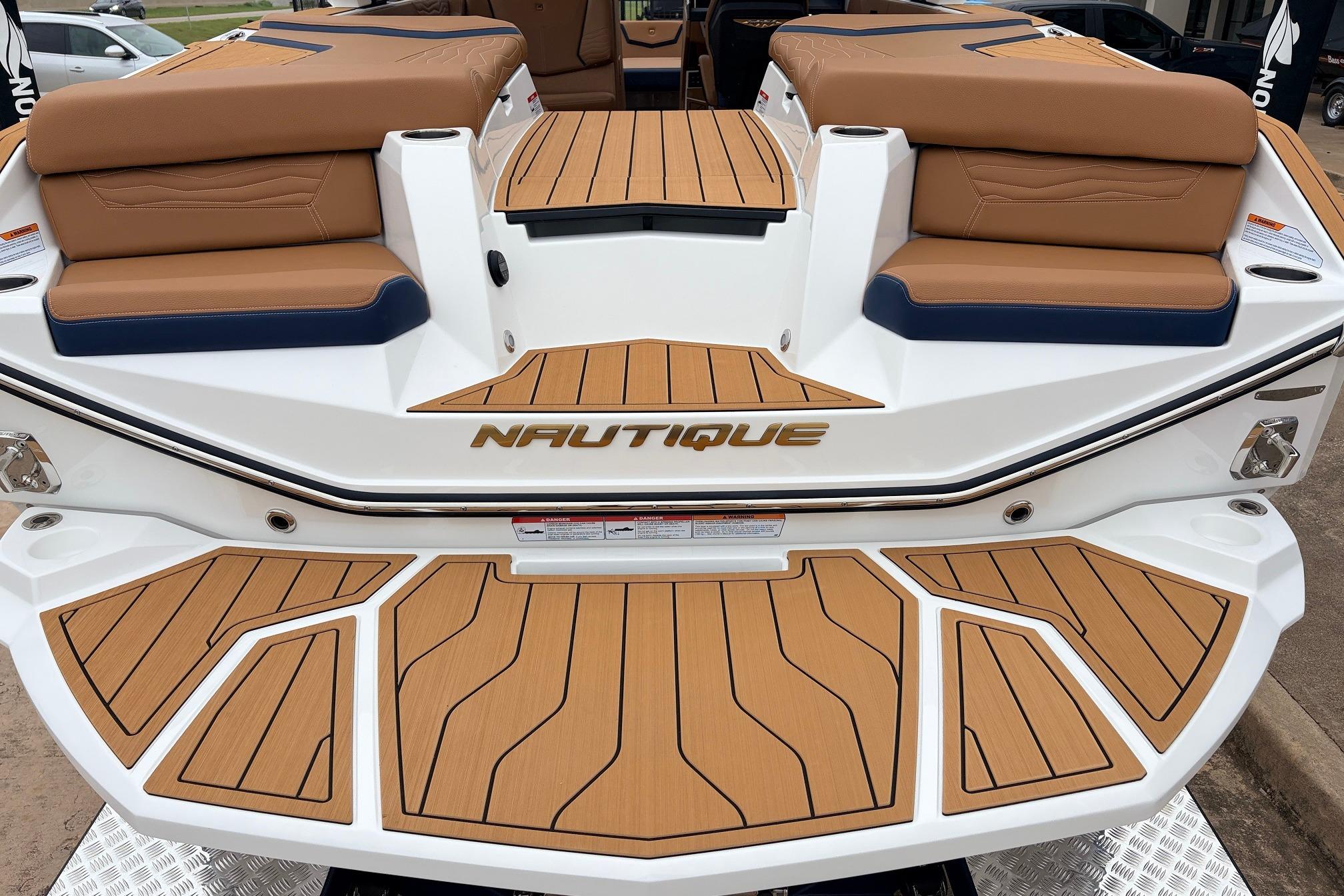 2026 Nautique Super Air Nautique G25 boat with teak deck and cushioned seating.