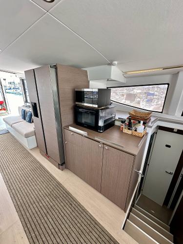 Modern interior of 2021 Bali 4.8 yacht with kitchen and seating area.