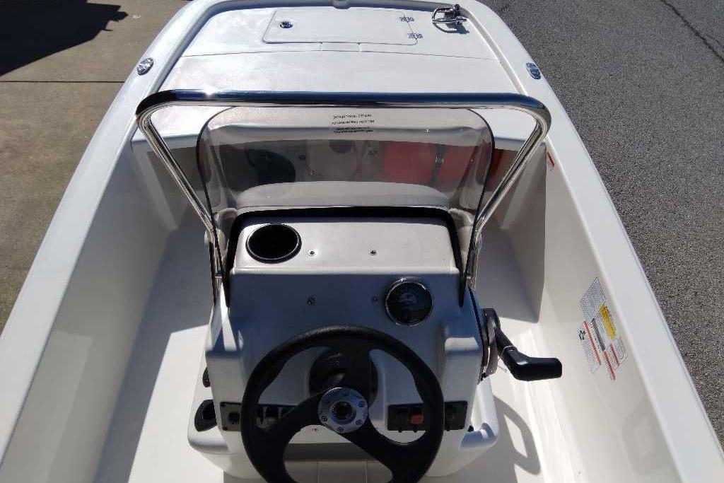 2026 Mako Pro Skiff 13 CC boat console with steering wheel and windshield.