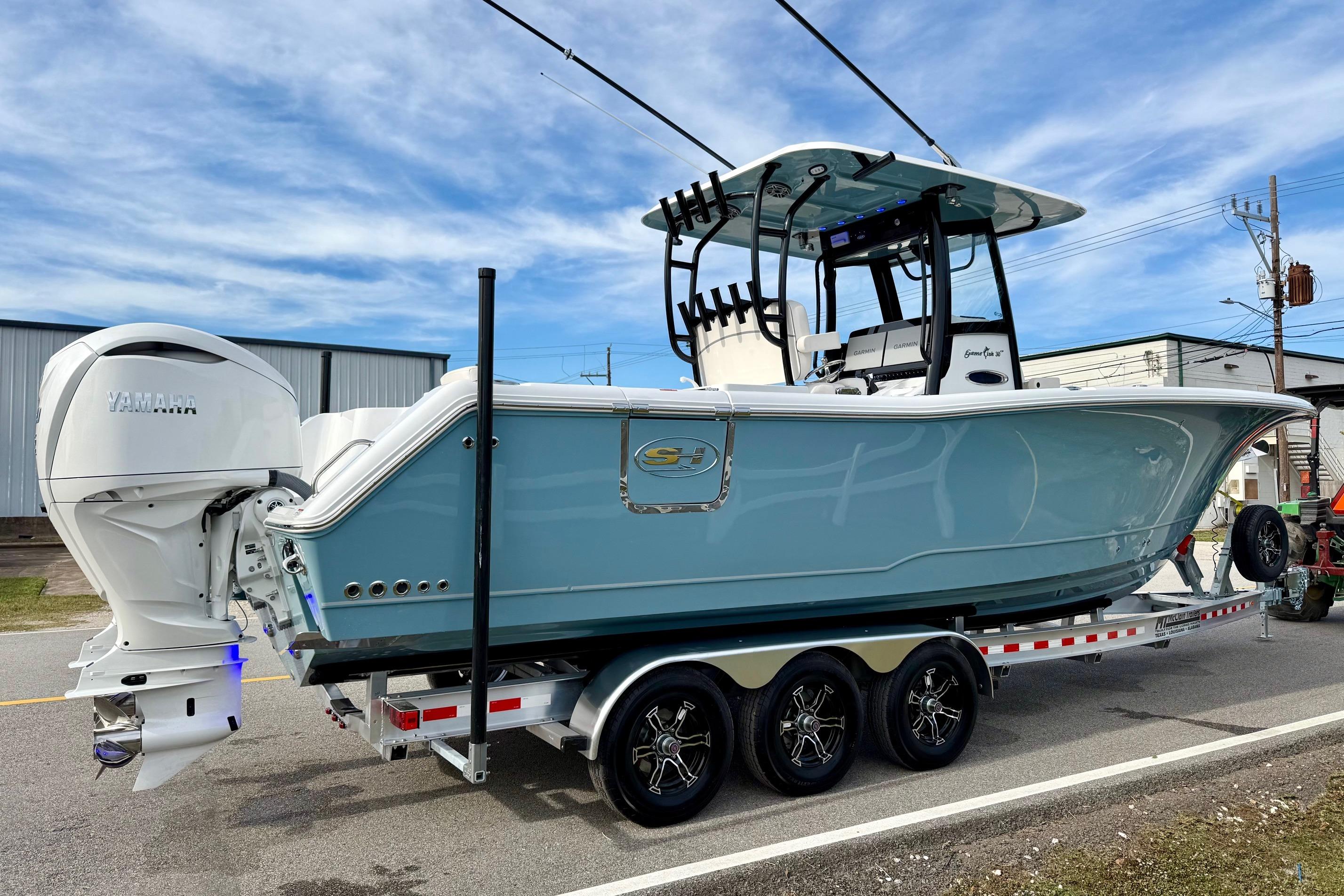 2026 Sea Hunt Gamefish 30 Coffin Box boat on trailer, featuring Yamaha engines.