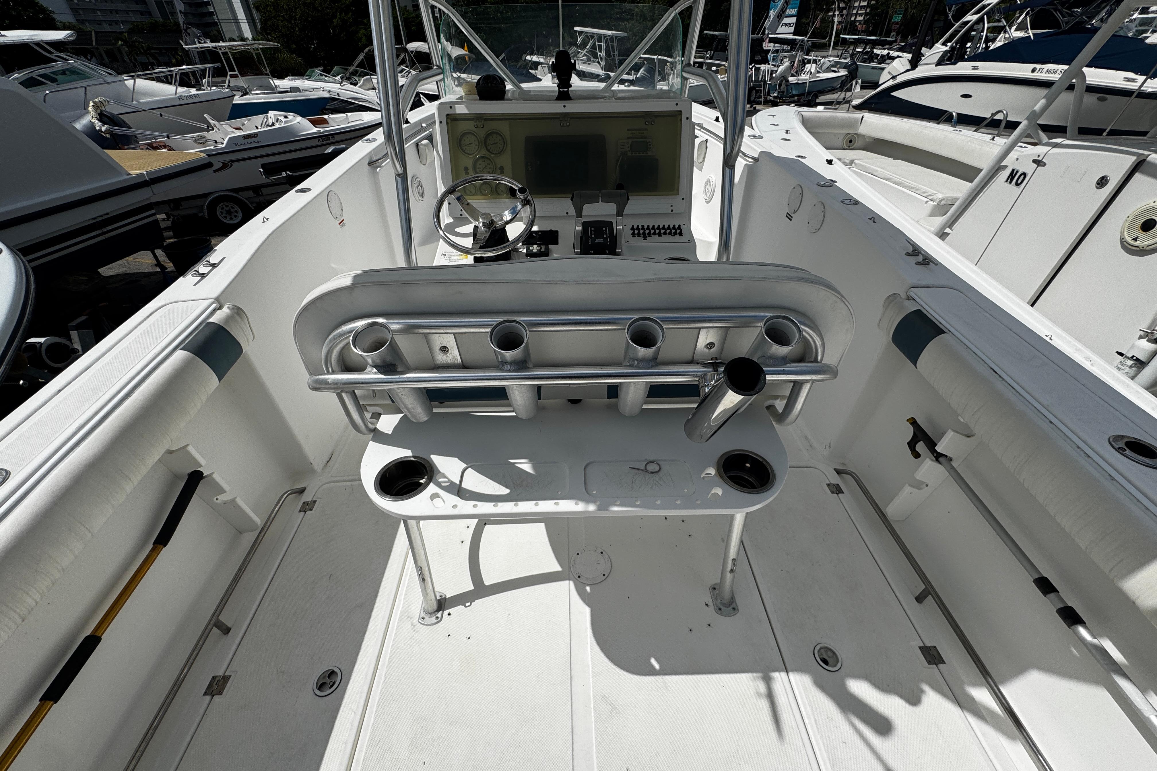 2008 Sea Fox 287 CC boat interior with steering console and rod holders.