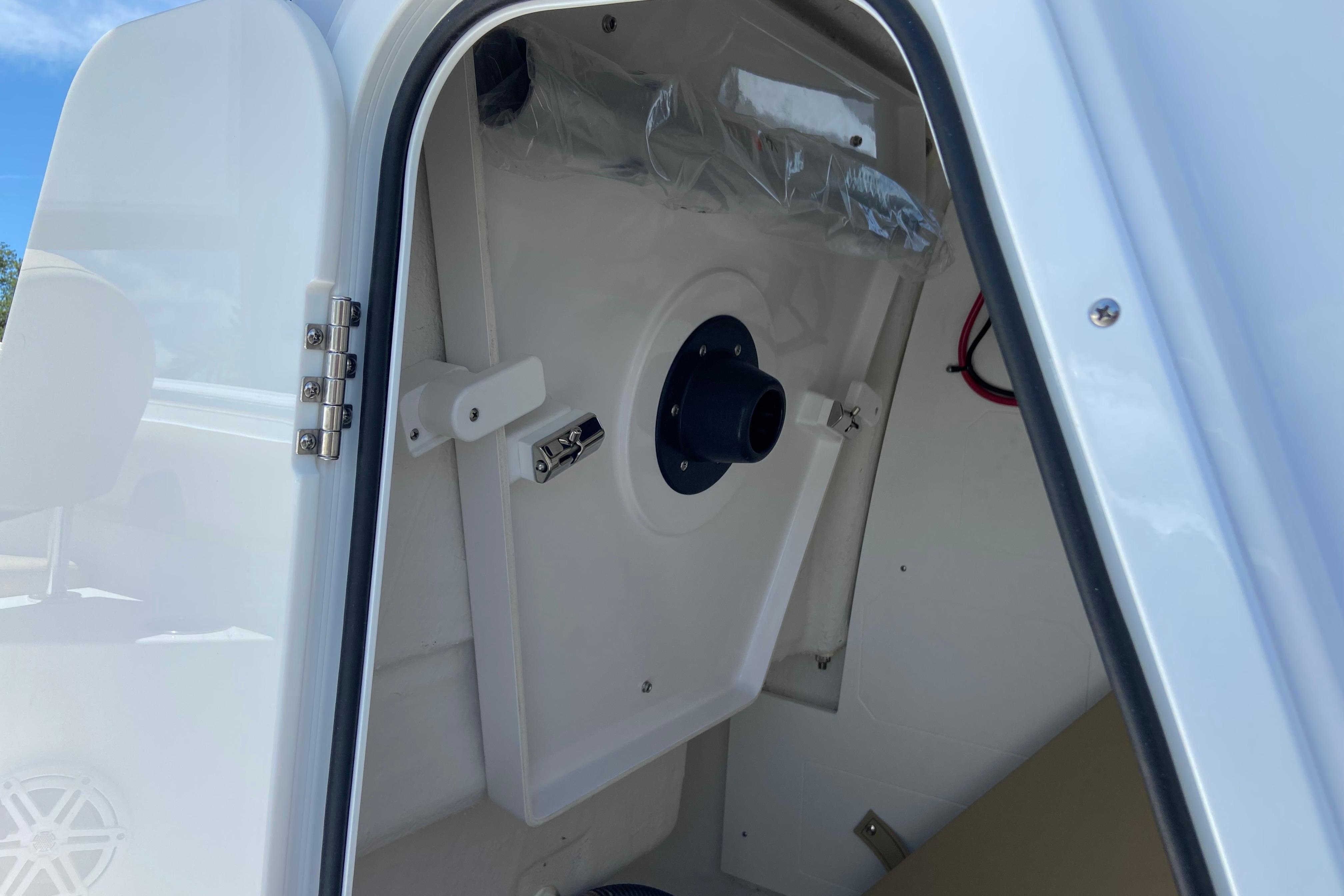2026 Sportsman Heritage 231 Center Console interior view with open hatch and storage compartment.