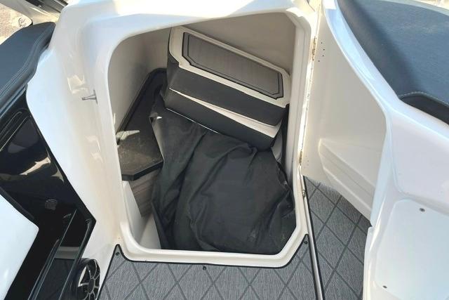 Storage compartment in 2021 Yamaha Boats 275SD, featuring spacious interior and sleek design.