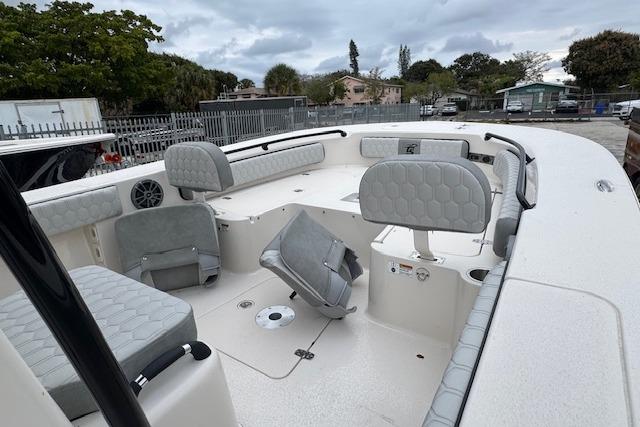 2026 Carolina Skiff 24 Ultra Elite boat interior with cushioned seating and spacious deck.