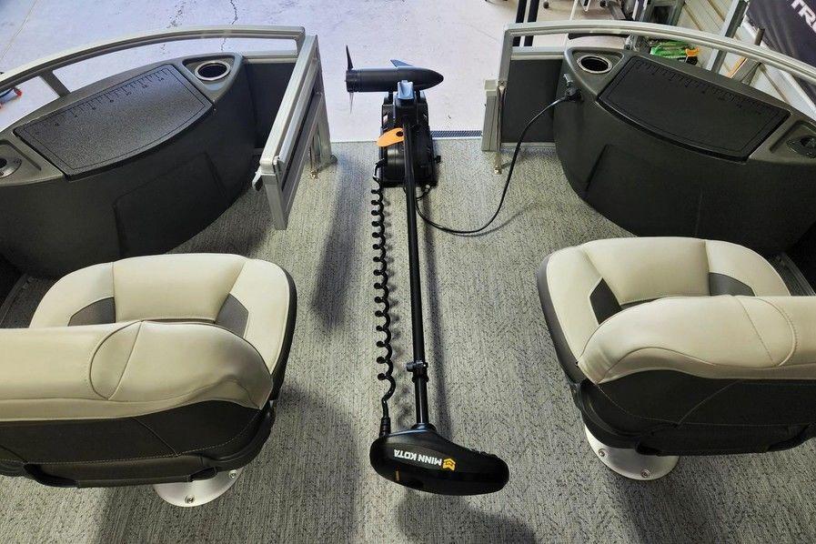 Interior of 2026 Sun Tracker Bass Buggy 18 DLX with seating and trolling motor.