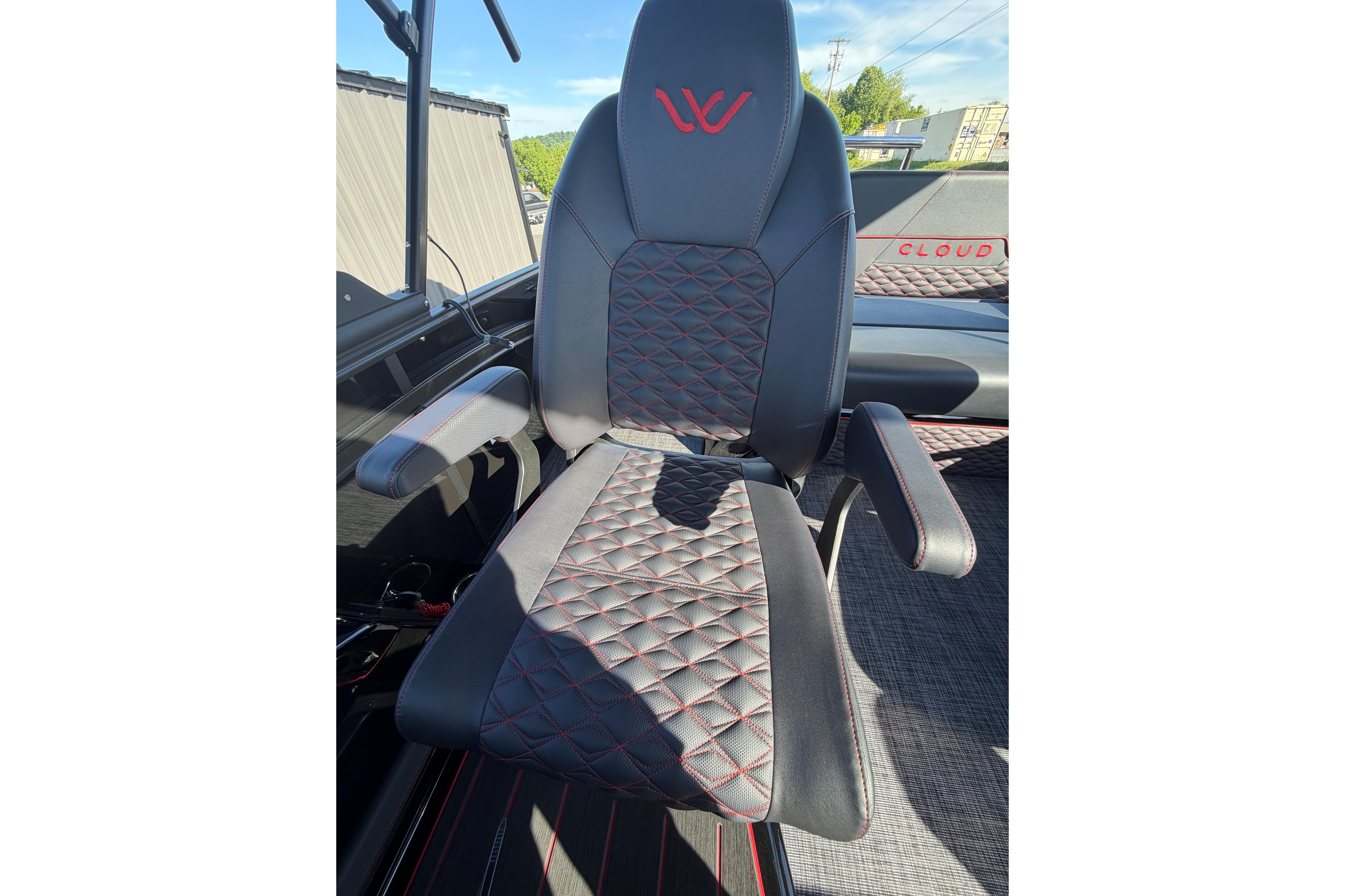 Luxurious black and red stitched seat in 2026 Whisper C25 Splash Pad boat.