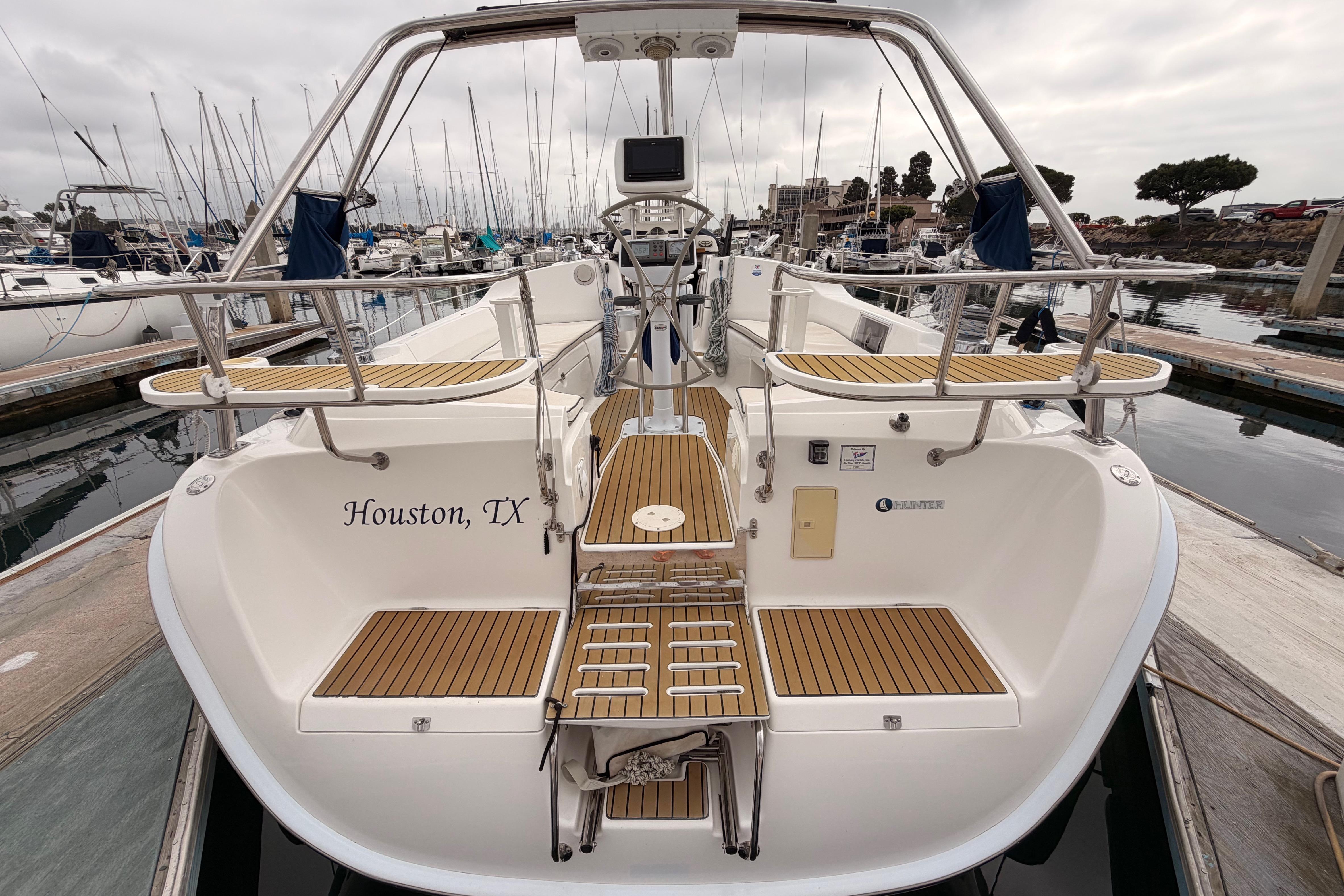 2009 Hunter 38 sailboat docked in marina, Houston, TX, with teak deck accents.