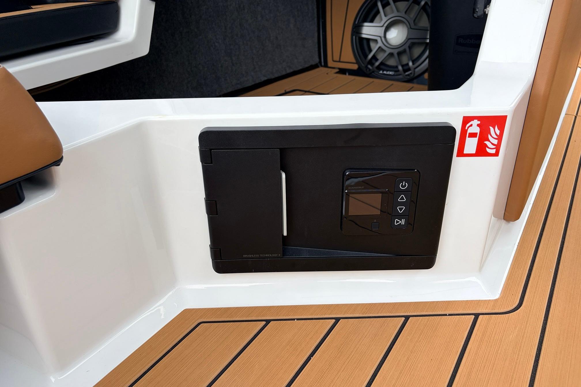 2026 Nautique Super Air Nautique G25 interior with control panel and speaker detail.