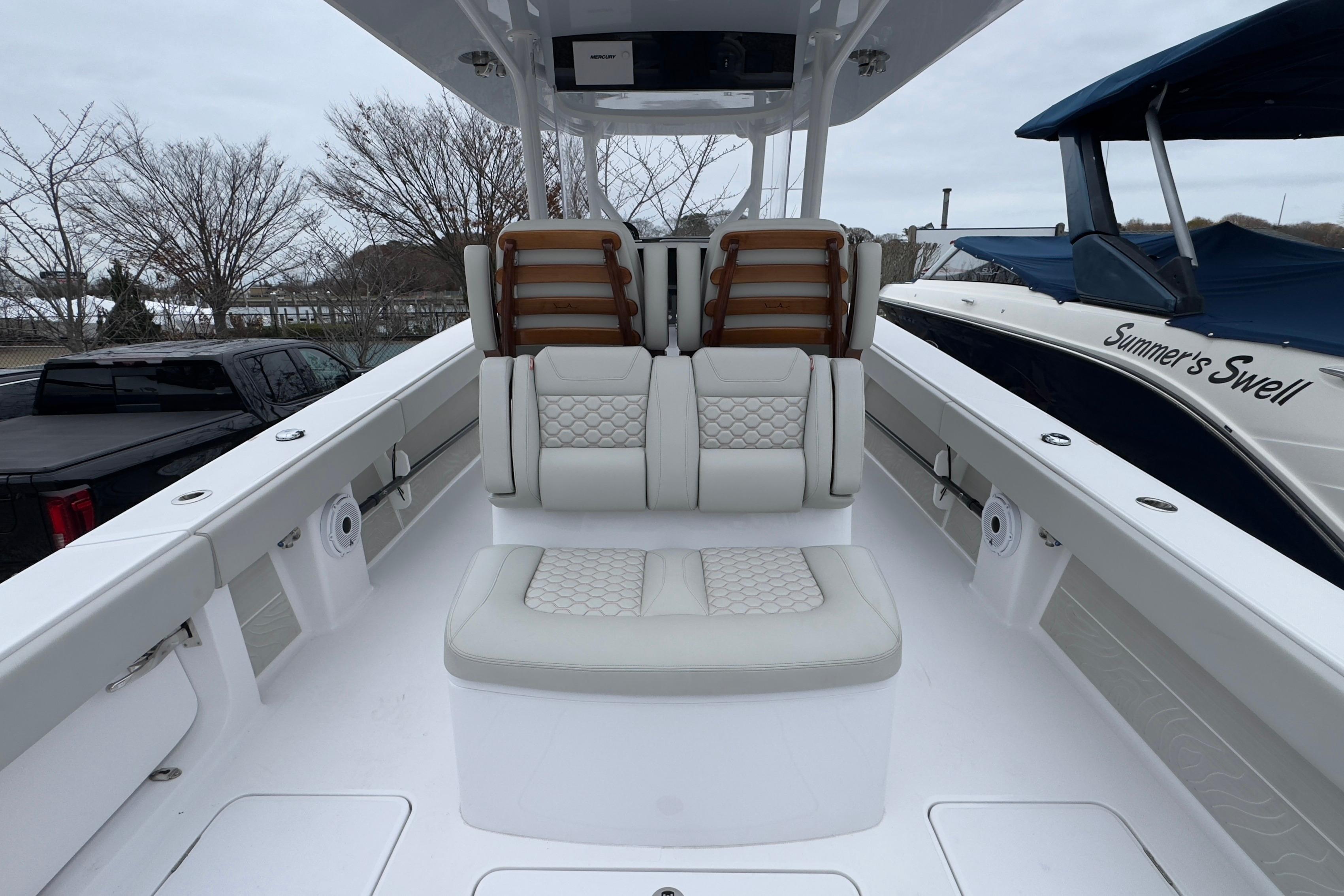 2024 Jupiter 32 FS boat interior with cushioned seating and sleek design.