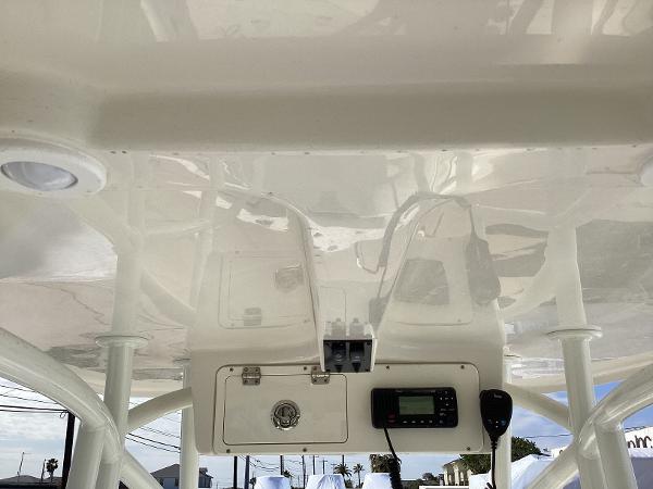 2022 Sailfish 220 CC boat console with radio and storage compartment.