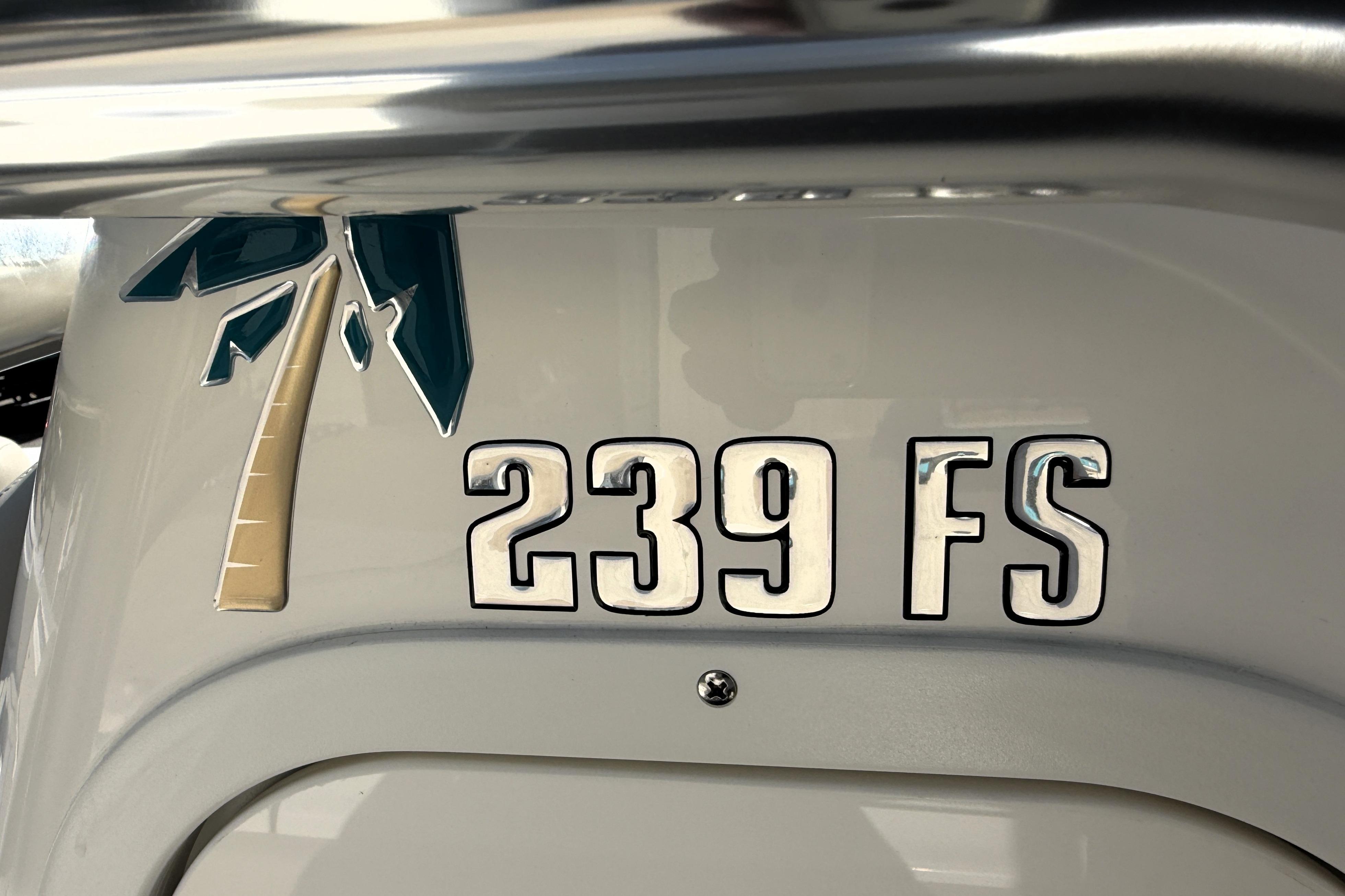 2025 Key West 239 FS boat emblem with palm tree design.