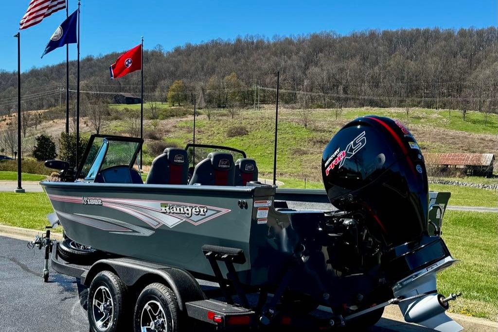 2026 Ranger VS1882SC Reata boat with Mercury engine, parked outdoors under clear sky.