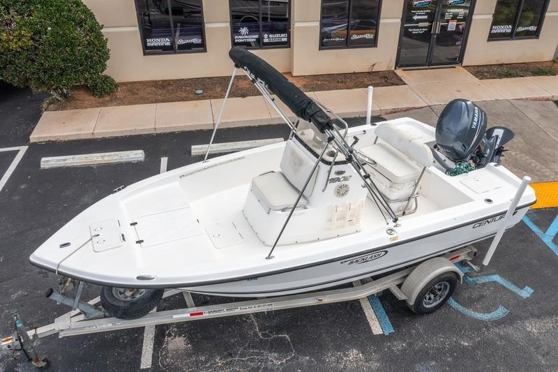 2005 Century 1902 Inshore boat on trailer, parked in a lot near a building.