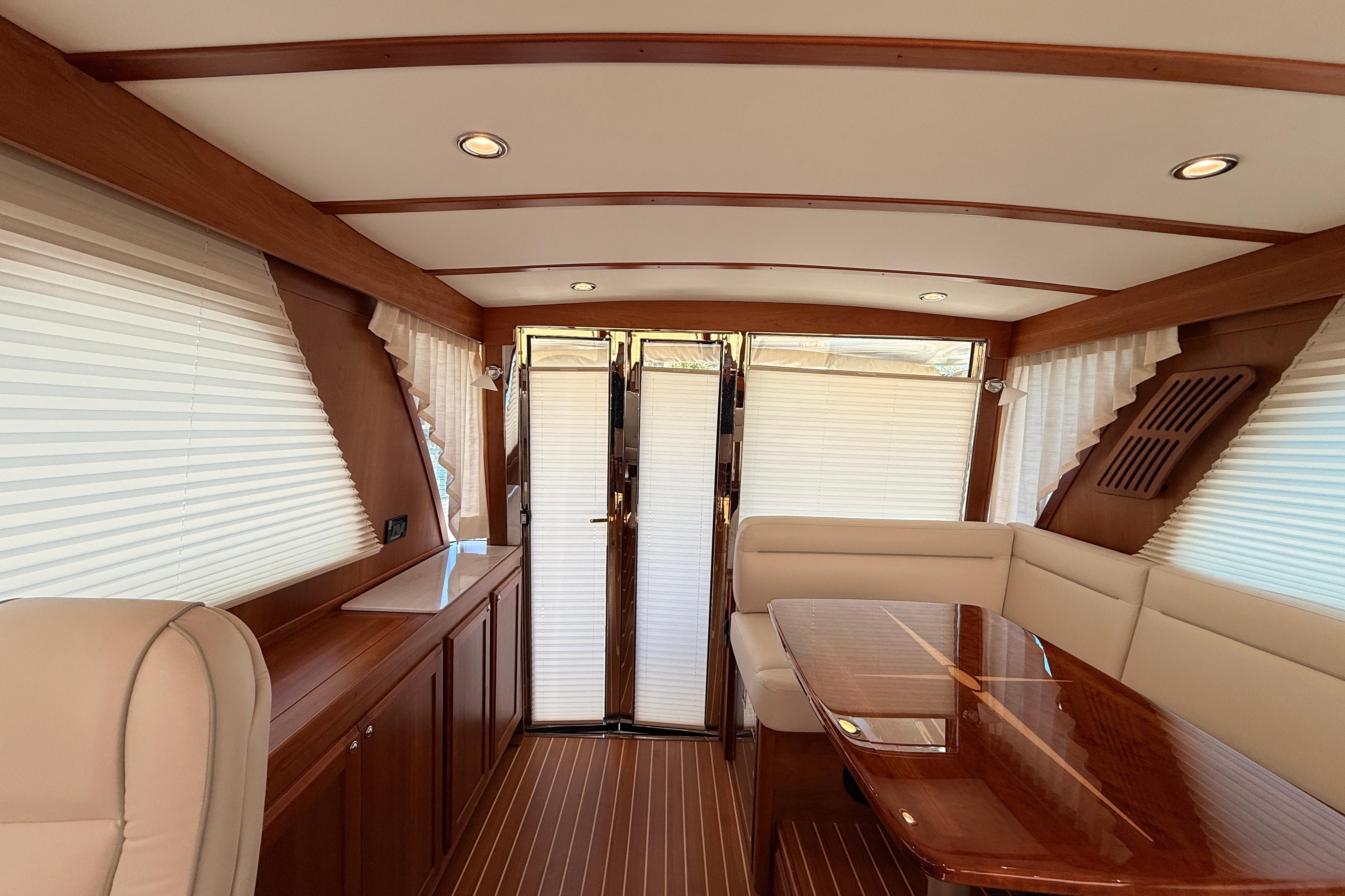 Luxurious interior of 2022 Sabre 38 Salon Express yacht with elegant wood finishes.