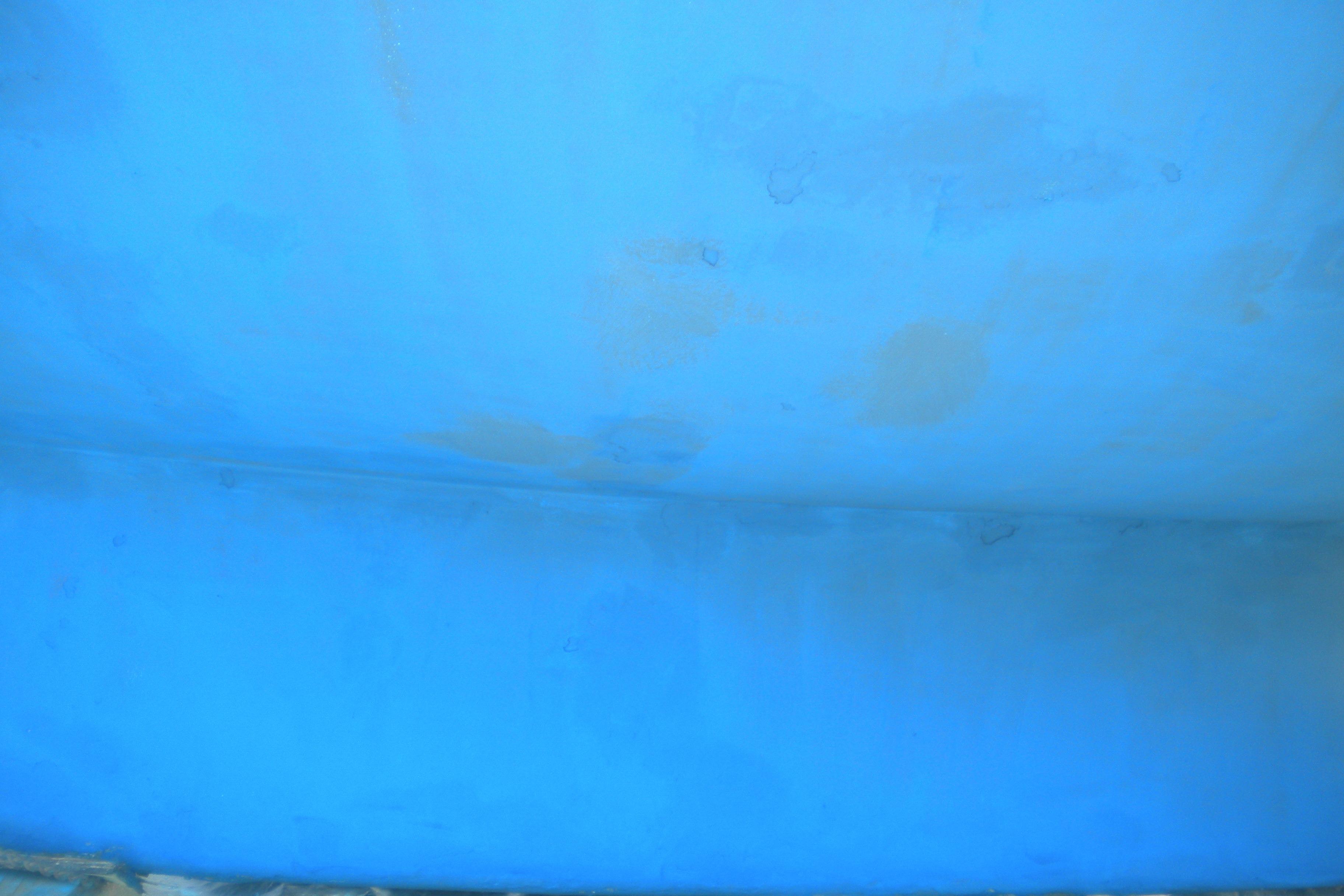 Close-up of a blue hull from a 1980 Sabre 34 sailboat.