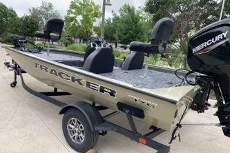 2026 Tracker Pro Team 175 boat with Mercury engine on trailer, parked outdoors.