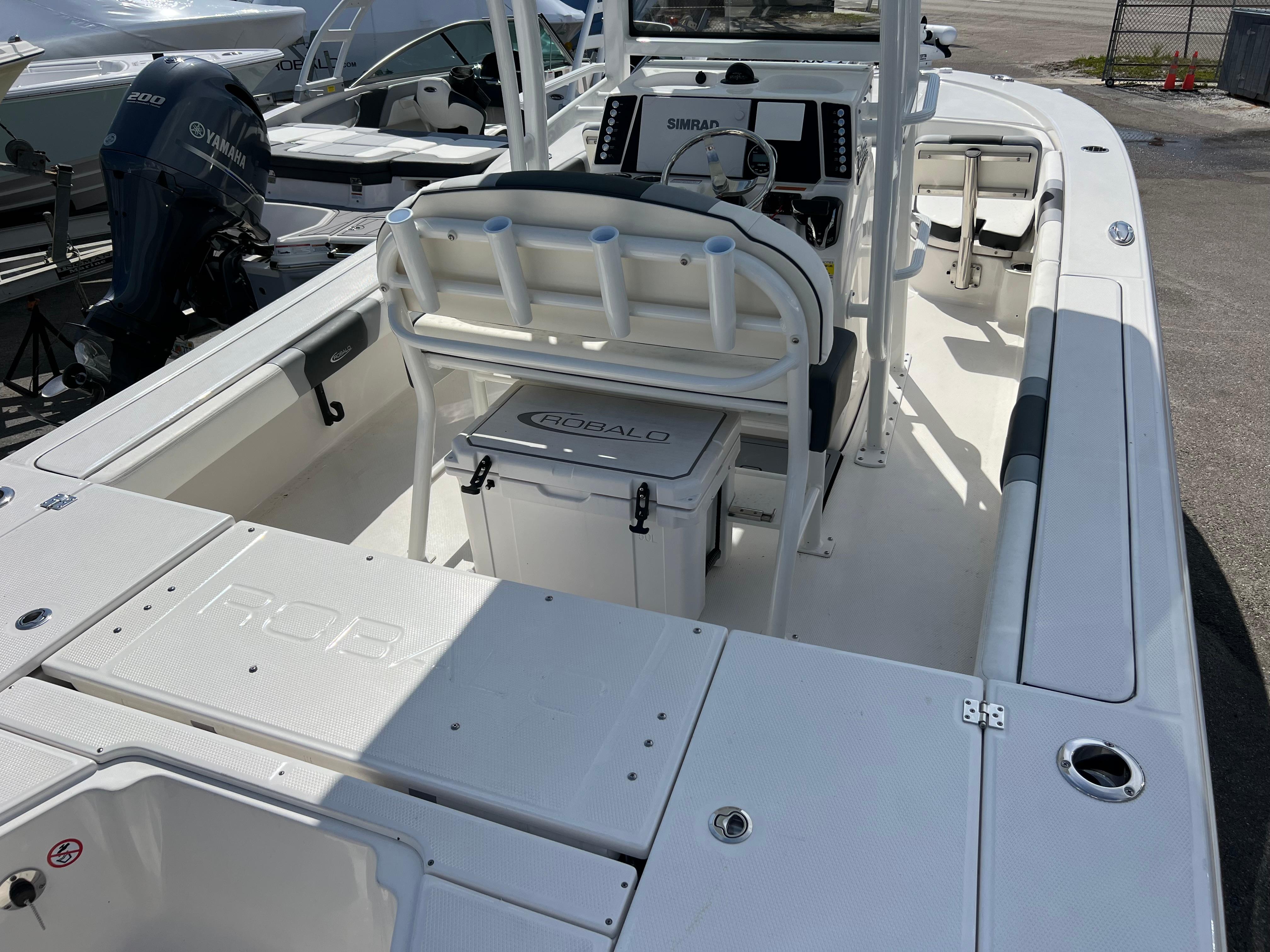 2024 Robalo 246 Sky Deck boat interior with helm station and seating.