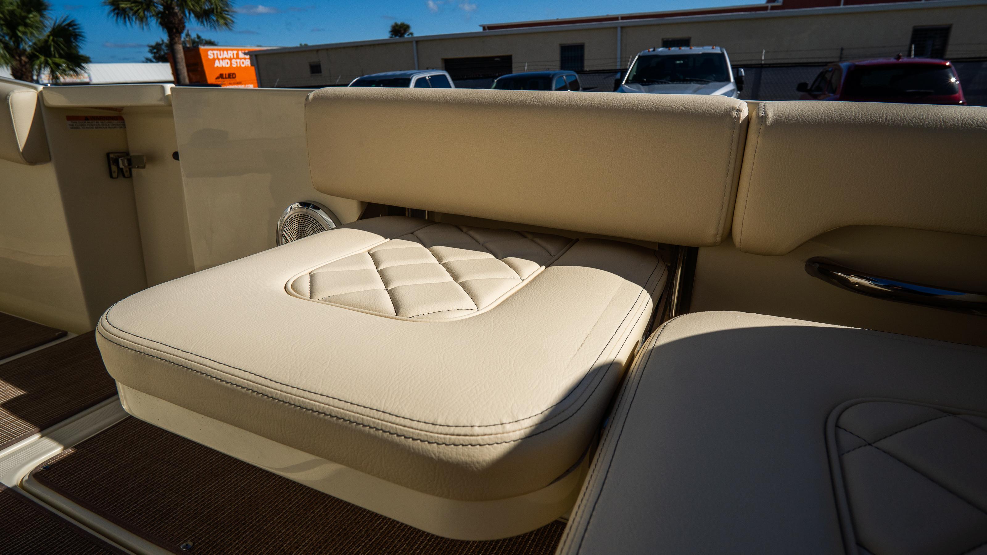 2025 Chris-Craft Catalina 30 boat interior with beige cushioned seating.