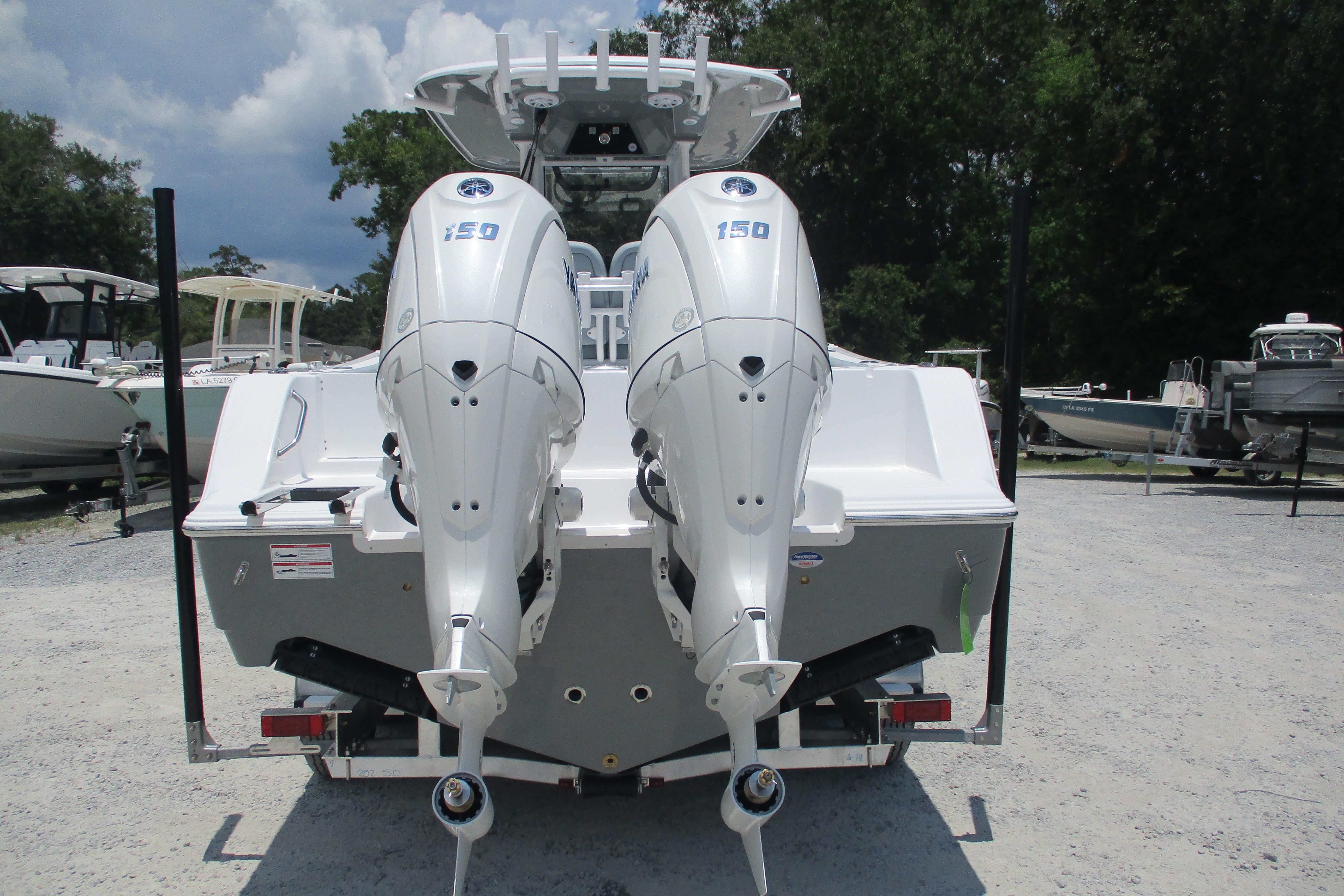 2027 Sportsman Open 252 Center Console with dual 150 horsepower engines, rear view.