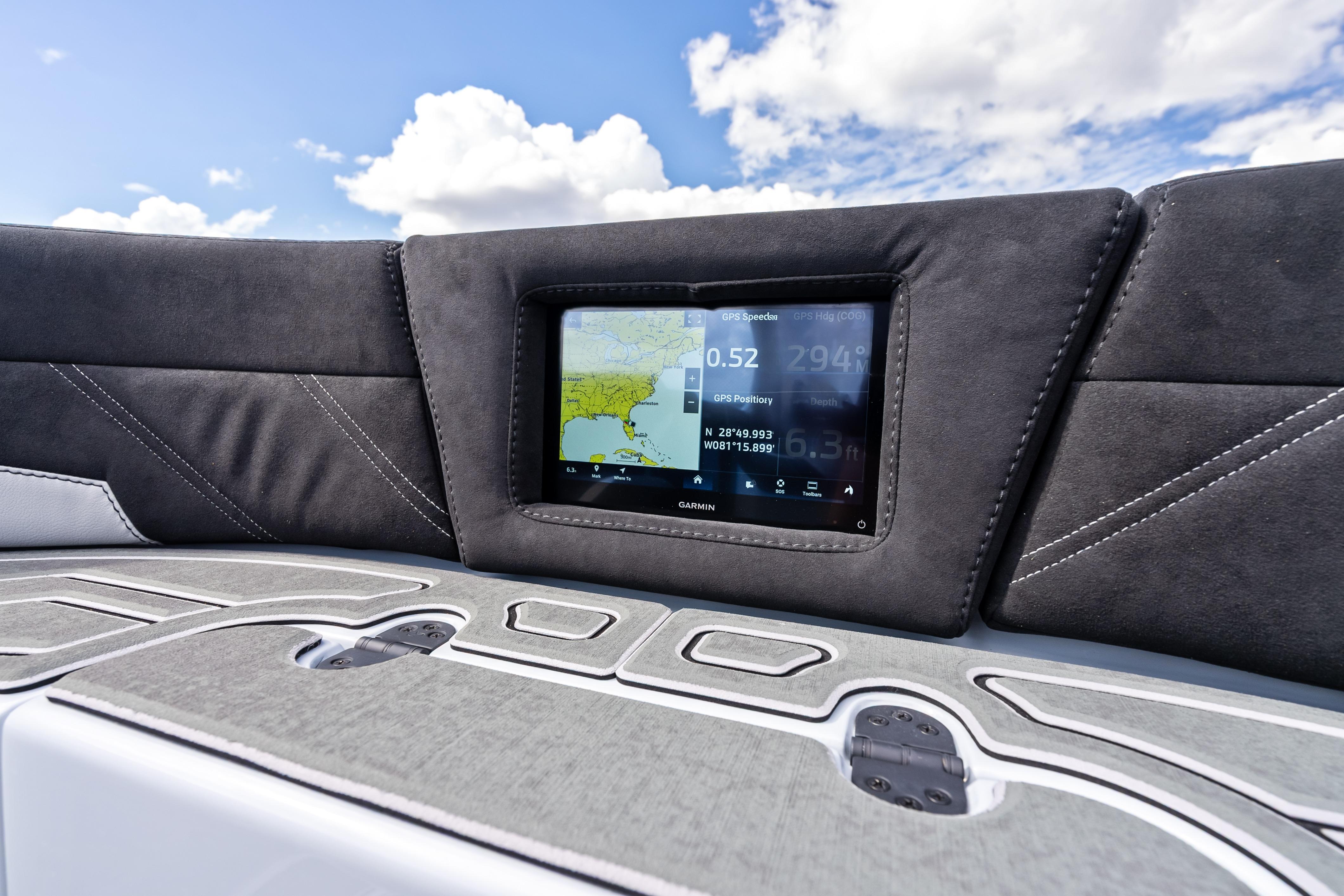 2027 Mystic Powerboats M4200 dashboard with GPS display under a clear blue sky.