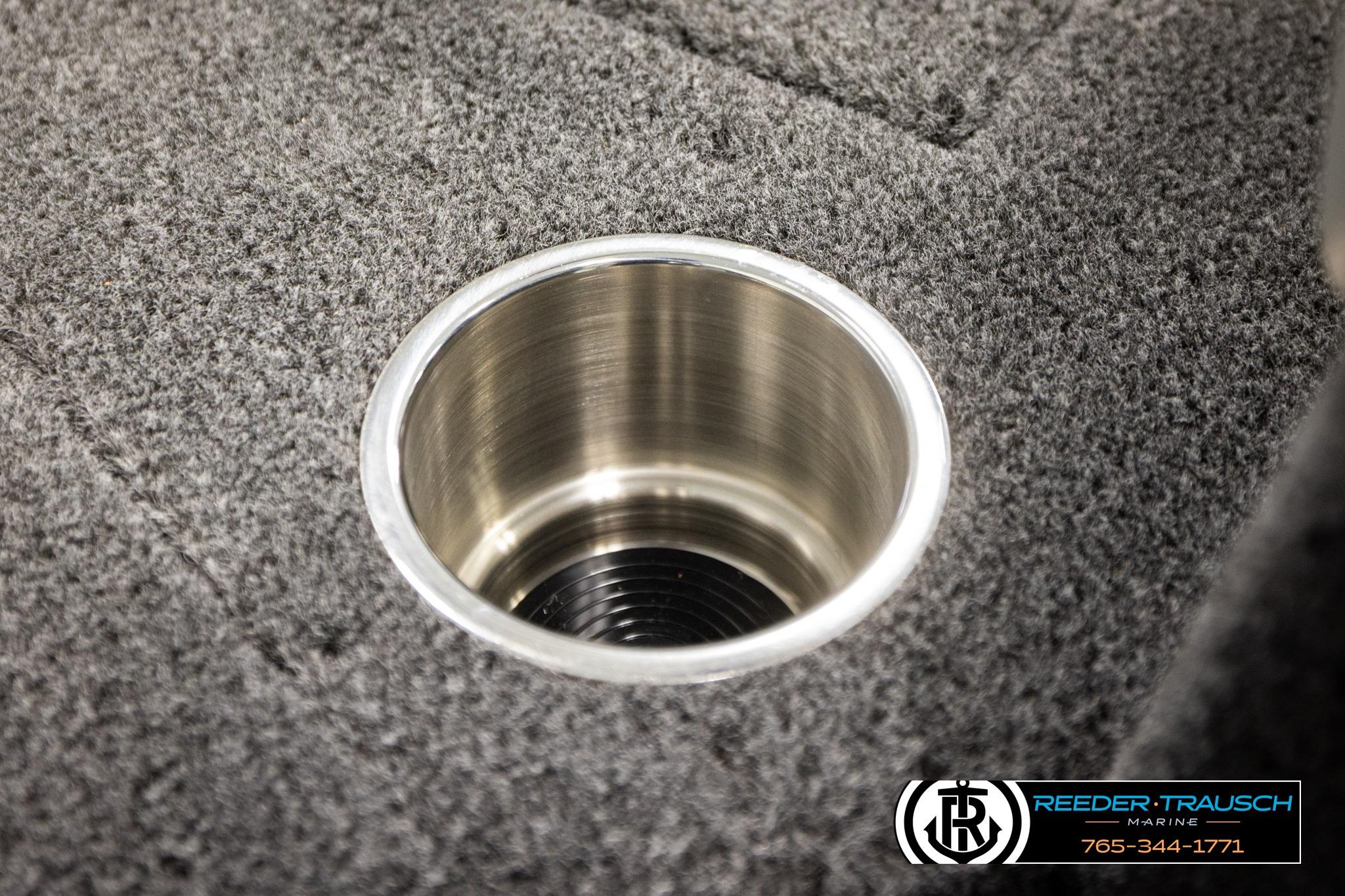 Stainless steel cup holder on 2026 Lund 1975 Tyee boat, carpeted surface.