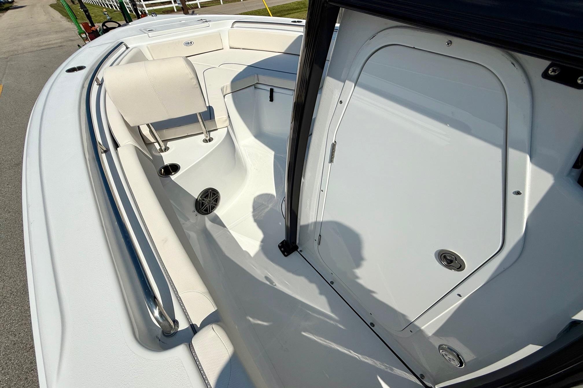 2026 Sea Hunt Ultra 229 boat interior with seating and storage compartment.